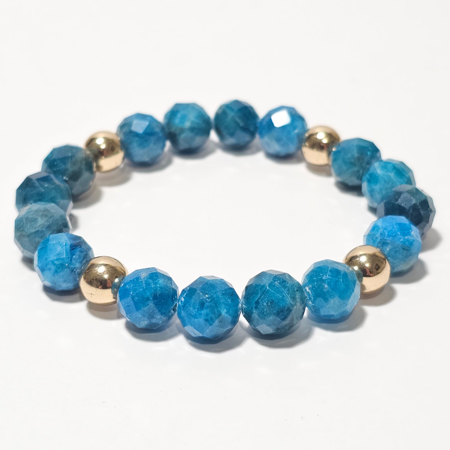 10mm Faceted Vibrant Blue Apatite and Gold Plated Hematite Bead Stretch Bracelet