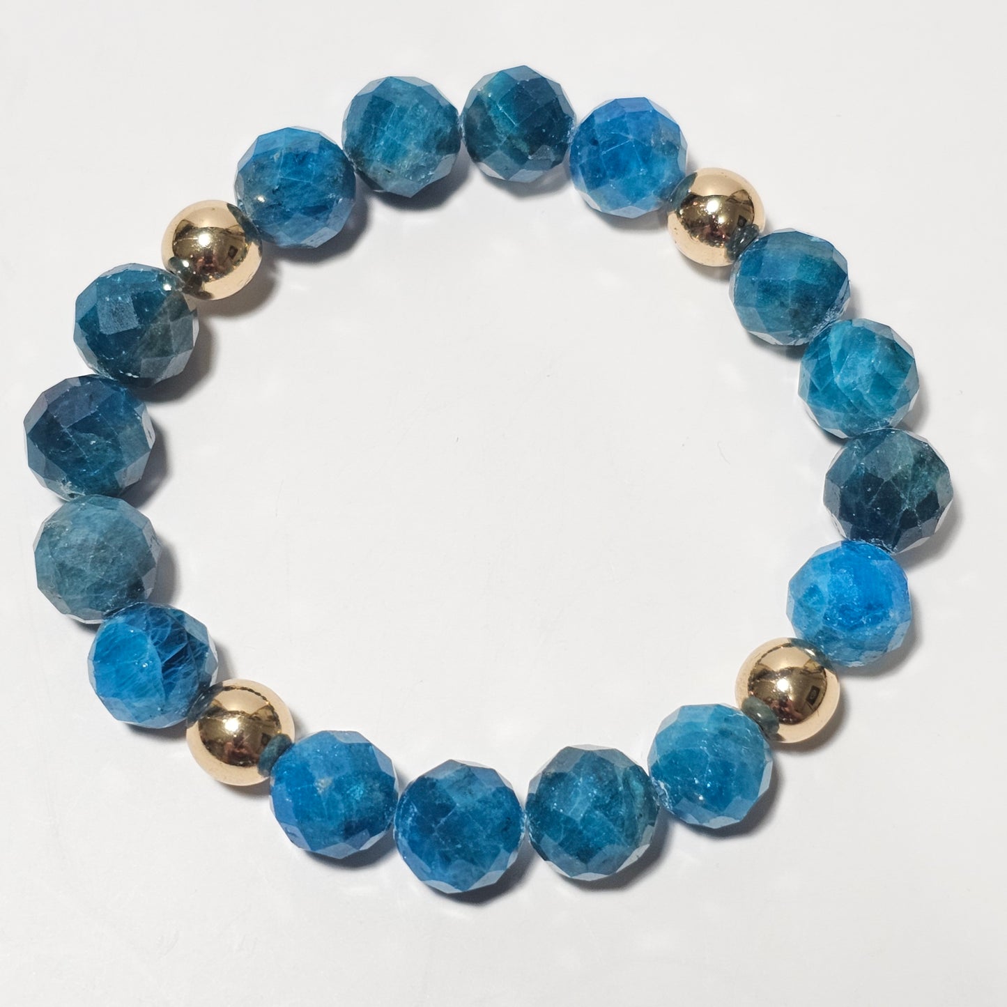 10mm Faceted Vibrant Blue Apatite and Gold Plated Hematite Bead Stretch Bracelet