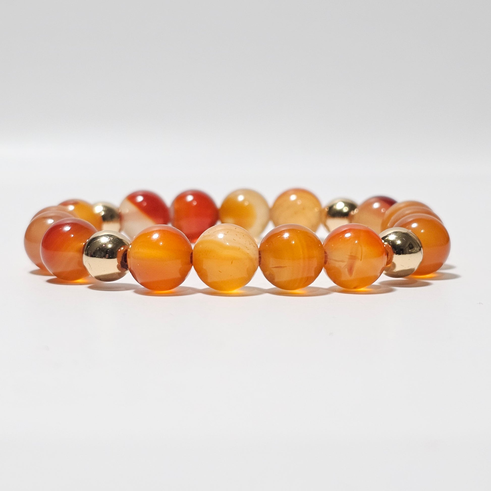 10mm Gorgeous A grade Carnelian and gold plated Hematite bead stretch bracelet.