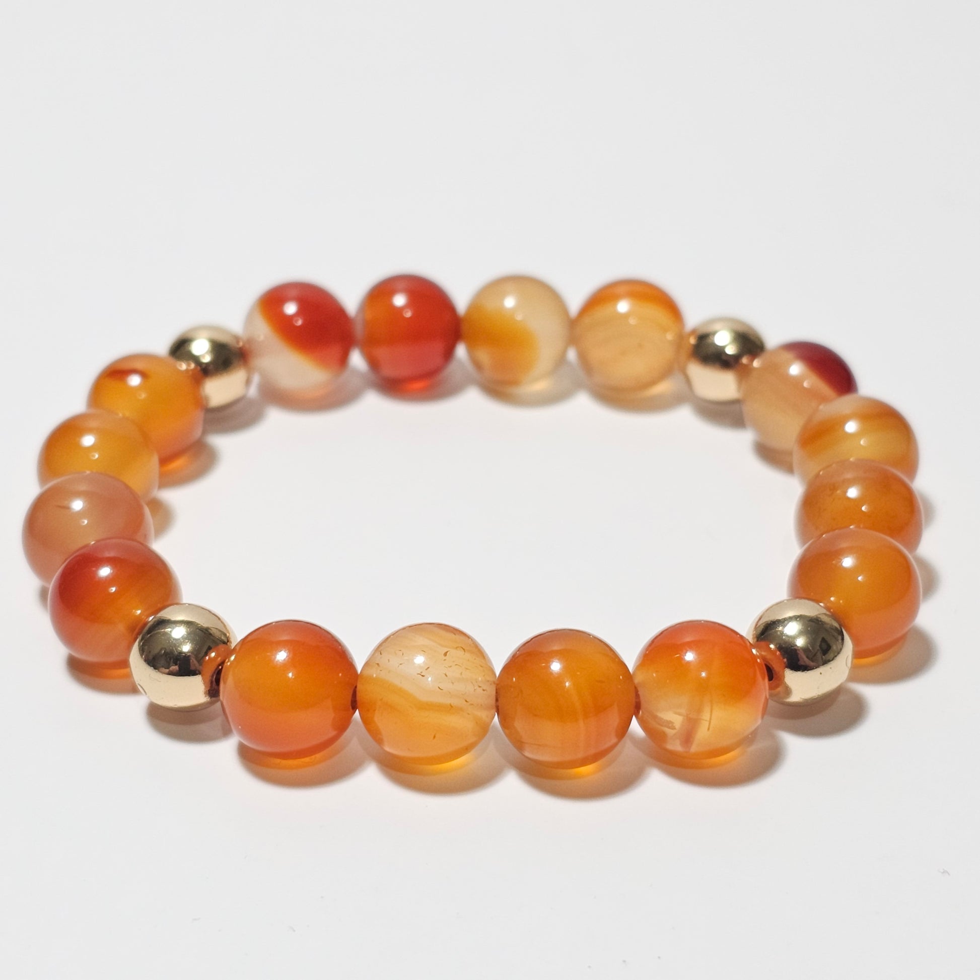 10mm Gorgeous A grade Carnelian and gold plated Hematite bead stretch bracelet.