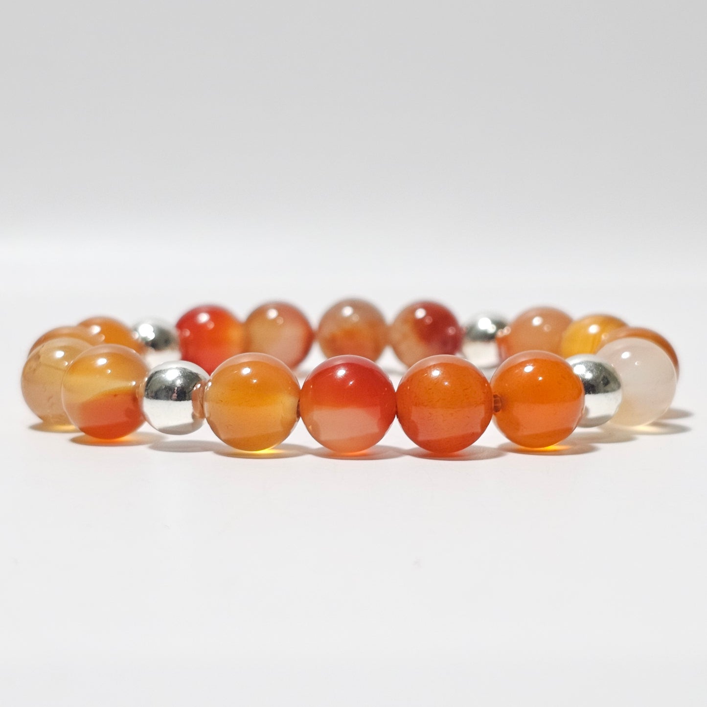 10mm Gorgeous A grade Carnelian and silver plated Hematite bead stretch bracelet.