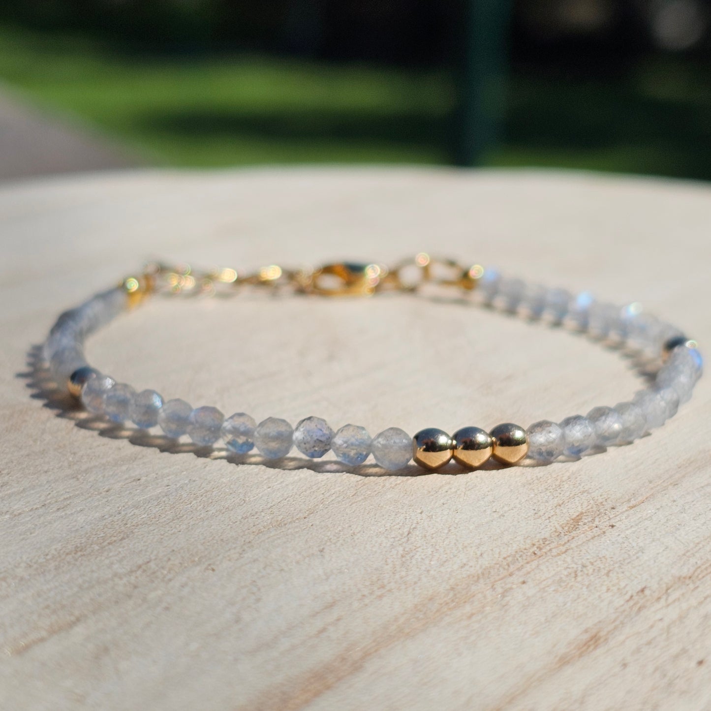 Delicate, faceted dainty Labradorite and AAA grade gold plated Hematite bead bracelet with a gold stainless steel clasp and extender chain.