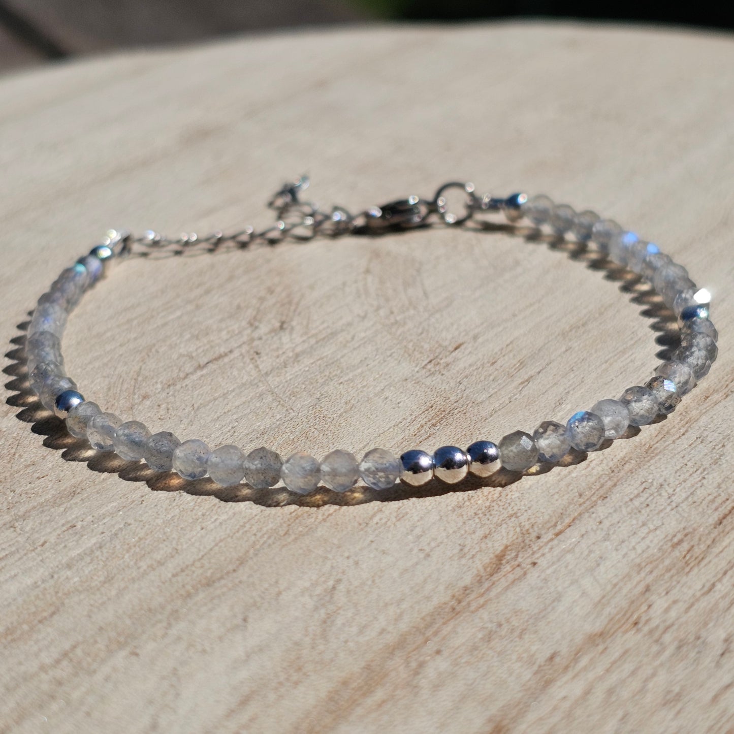 Delicate, faceted dainty Labradorite and AAA grade silver plated Hematite bead bracelet with a silver stainless steel clasp and extender chain.