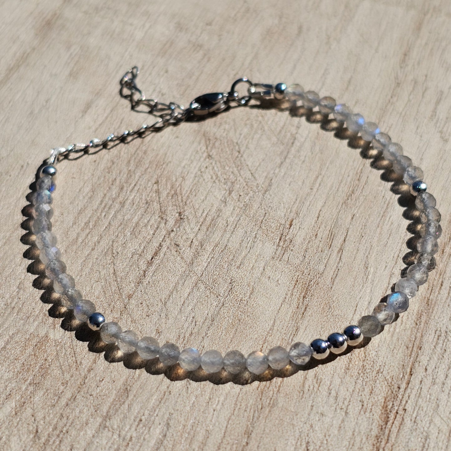 Delicate, faceted dainty Labradorite and AAA grade silver plated Hematite bead bracelet with a silver stainless steel clasp and extender chain.