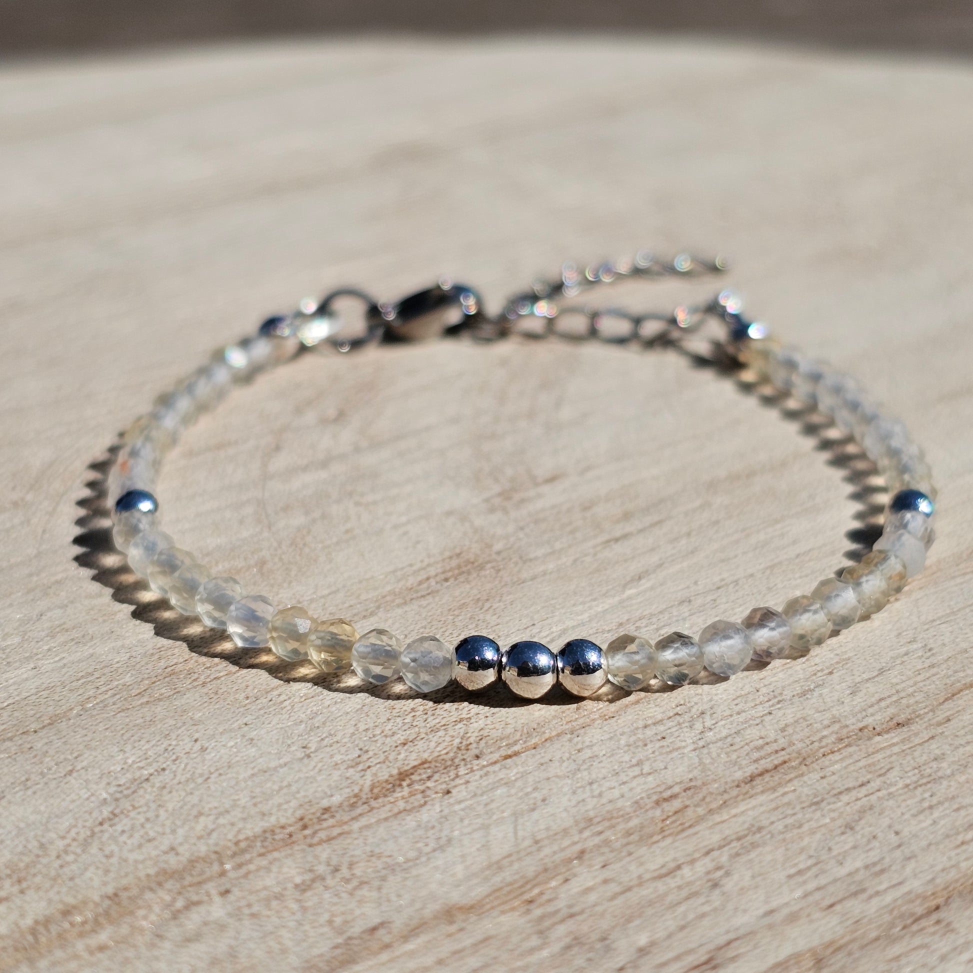 Delicate, faceted dainty Citrine and AAA grade silver plated Hematite bead bracelet with a silver stainless steel clasp and extender chain.