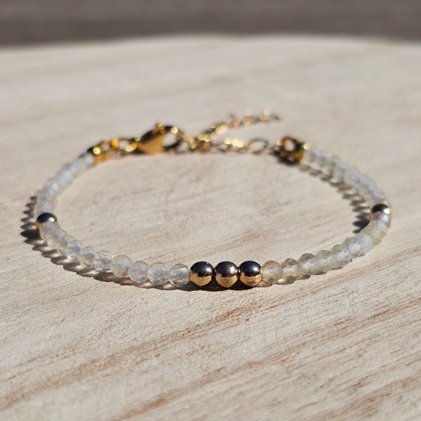 Delicate, faceted dainty Citrine and AAA grade gold plated Hematite bead bracelet with a gold stainless steel clasp and extender chain.