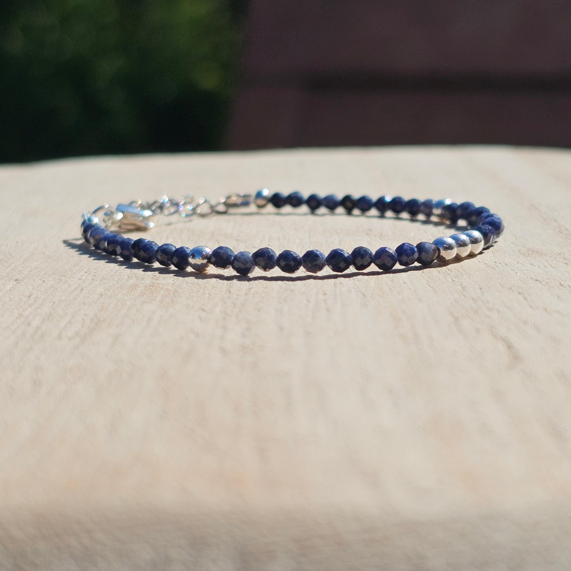 Delicate, faceted dainty A grade Sapphire and AAA grade silver plated Hematite bead bracelet with a silver stainless steel clasp and extender chain.