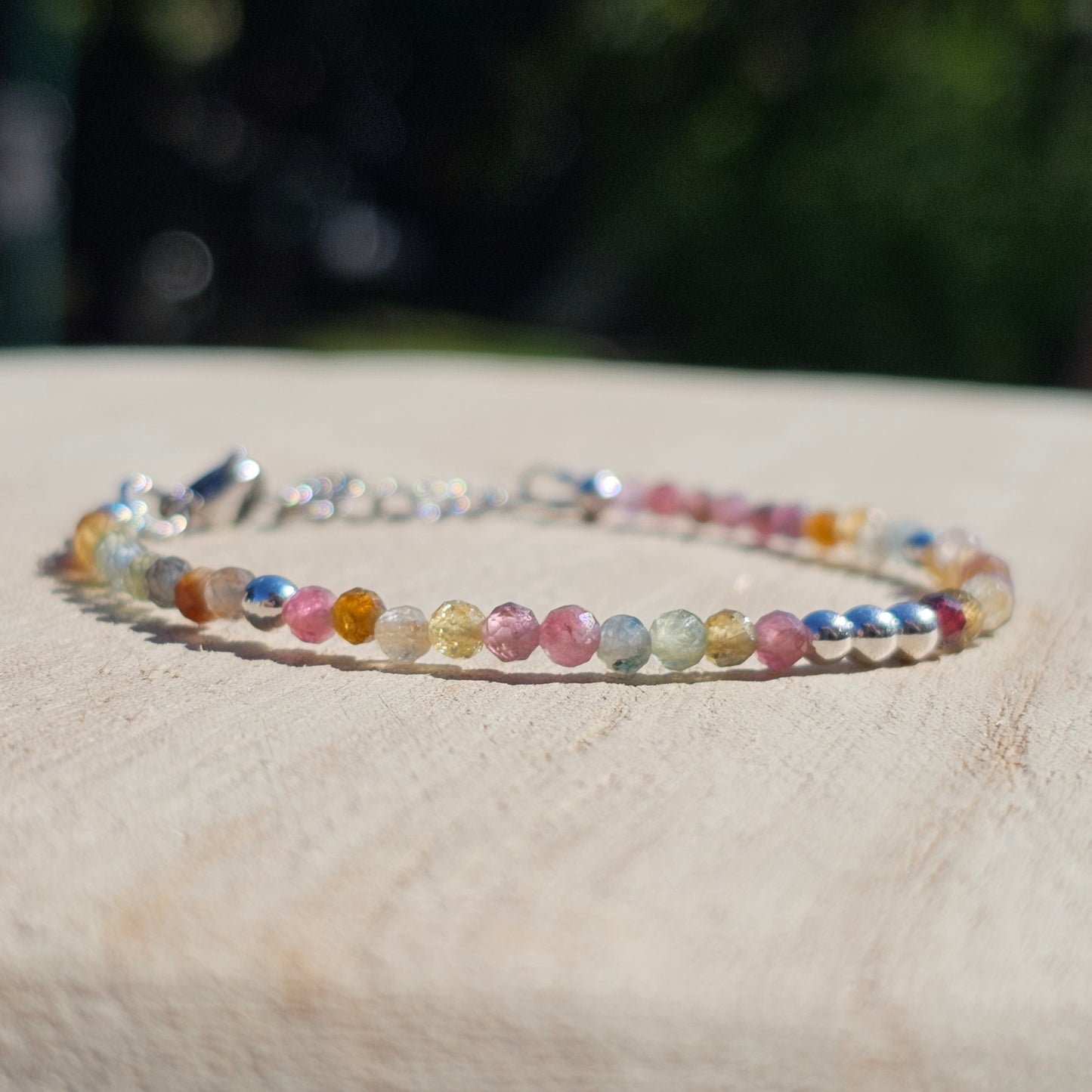 Delicate, faceted dainty AA grade colourful Tourmaline and AAA grade silver plated Hematite bead bracelet with a silver stainless steel clasp and extender chain.