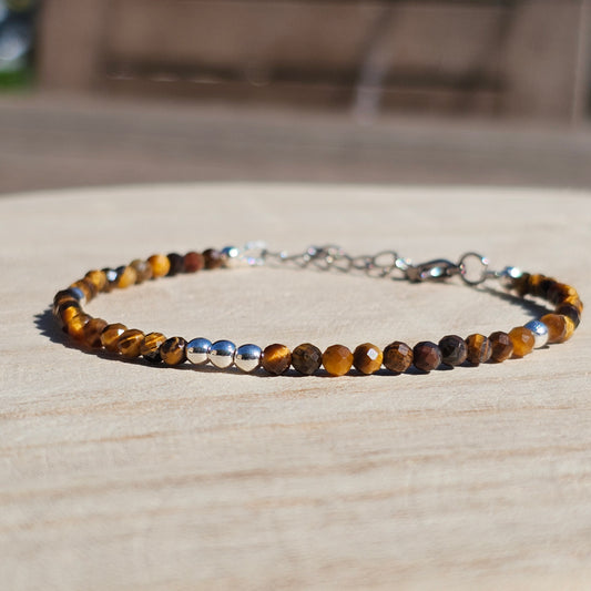 Delicate, faceted dainty Tiger's Eye and AAA grade silver plated Hematite bead bracelet with a silver stainless steel clasp and extender chain.