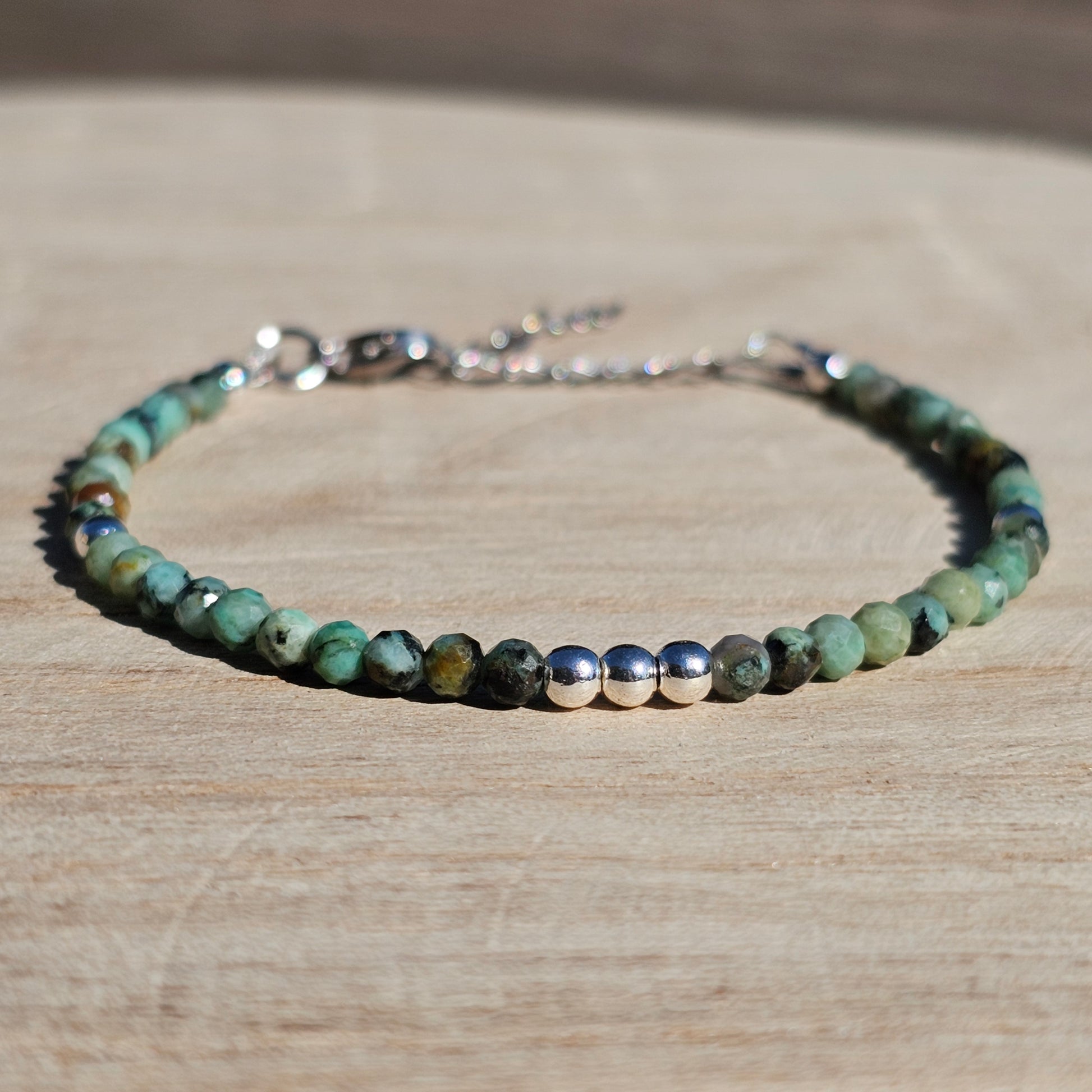 Delicate, faceted dainty African Turquoise and AAA grade silver plated Hematite bead bracelet with a silver stainless steel clasp and extender chain.