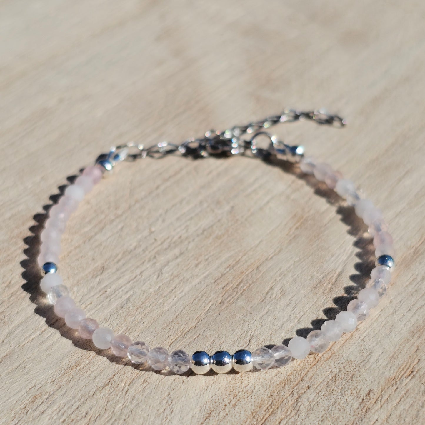 Delicate, faceted dainty Rose Quartz and AAA grade silver plated Hematite bead bracelet with a silver stainless steel clasp and extender chain.