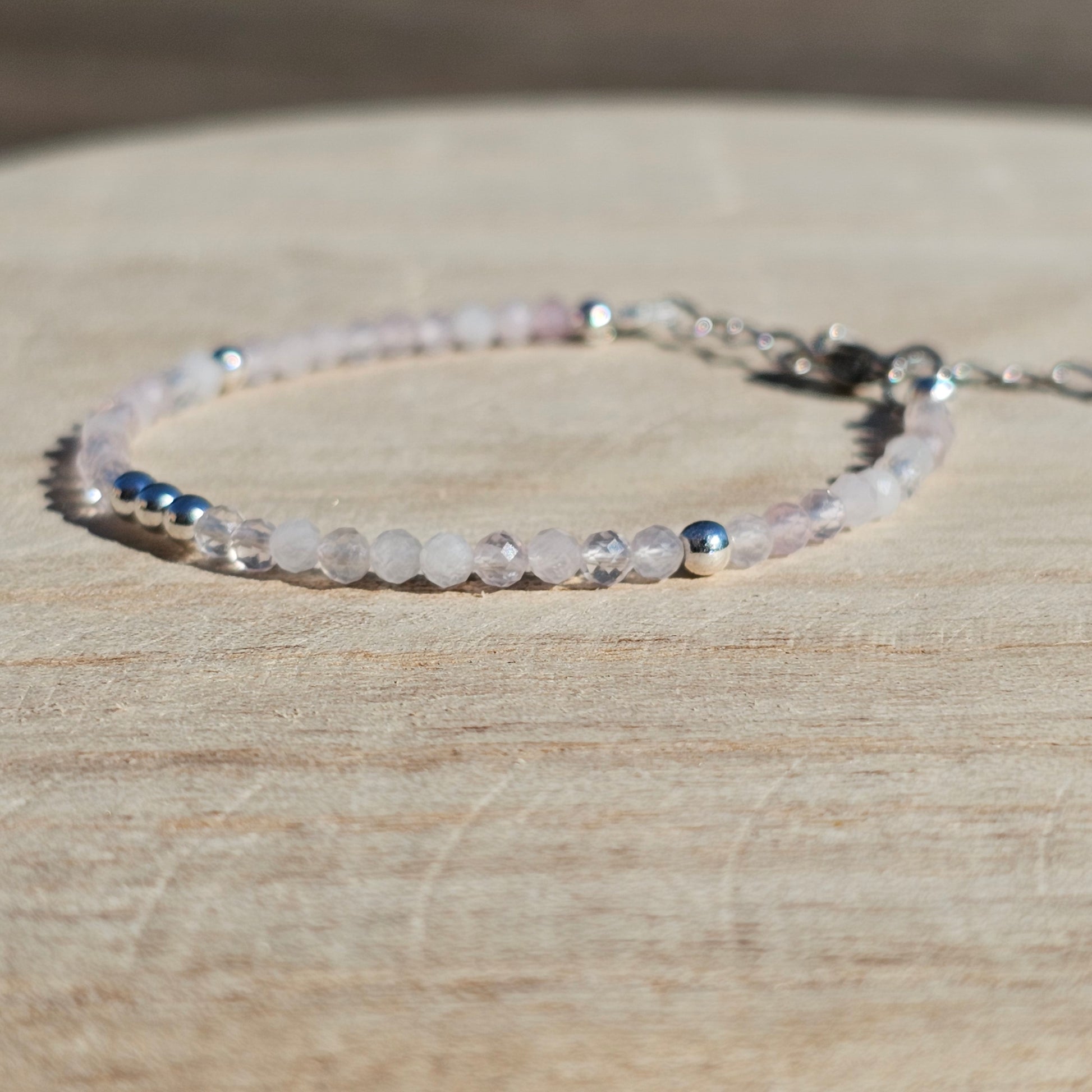 Delicate, faceted dainty Rose Quartz and AAA grade silver plated Hematite bead bracelet with a silver stainless steel clasp and extender chain.