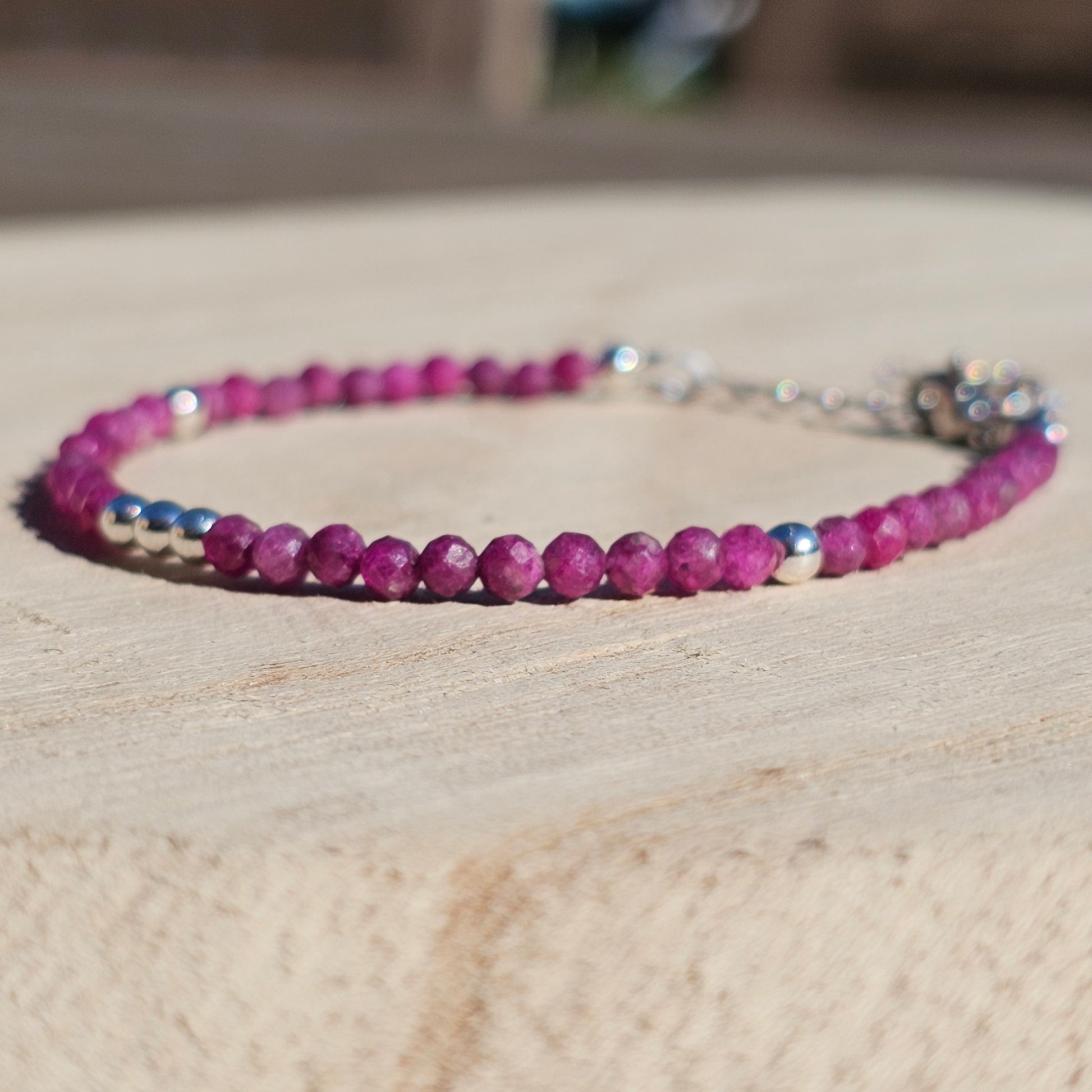 Delicate, faceted dainty Ruby and AAA grade silver plated Hematite bead bracelet with a silver stainless steel clasp and extender chain.