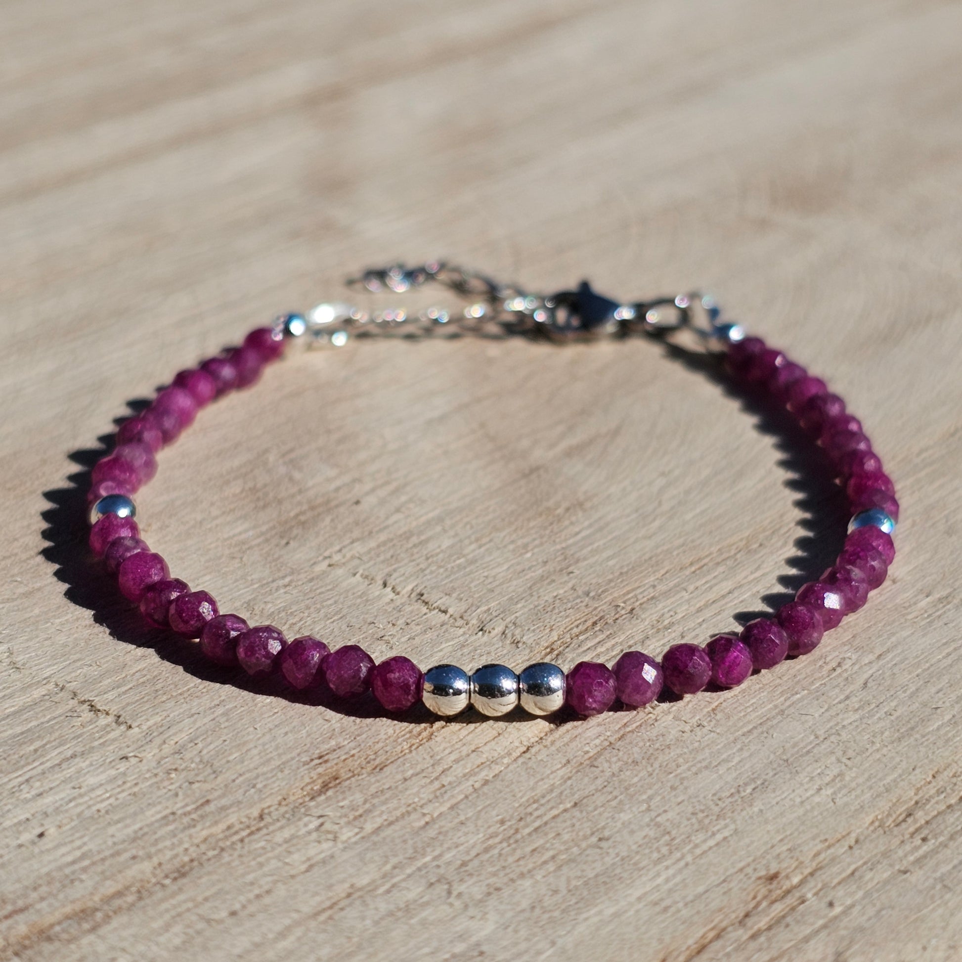 Delicate, faceted dainty Ruby and AAA grade silver plated Hematite bead bracelet with a silver stainless steel clasp and extender chain.