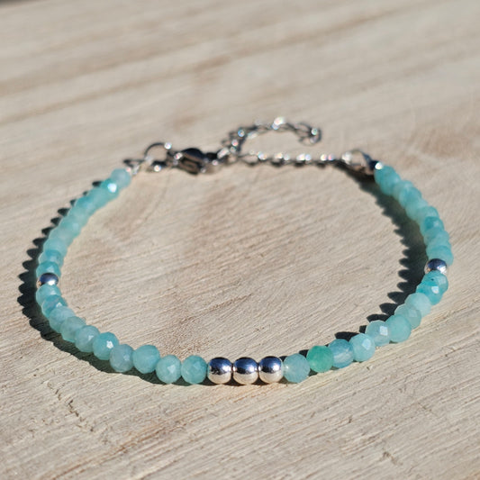 Delicate, faceted dainty A grade Amazonite and AAA grade silver plated Hematite bead bracelet with a silver stainless steel clasp and extender chain.