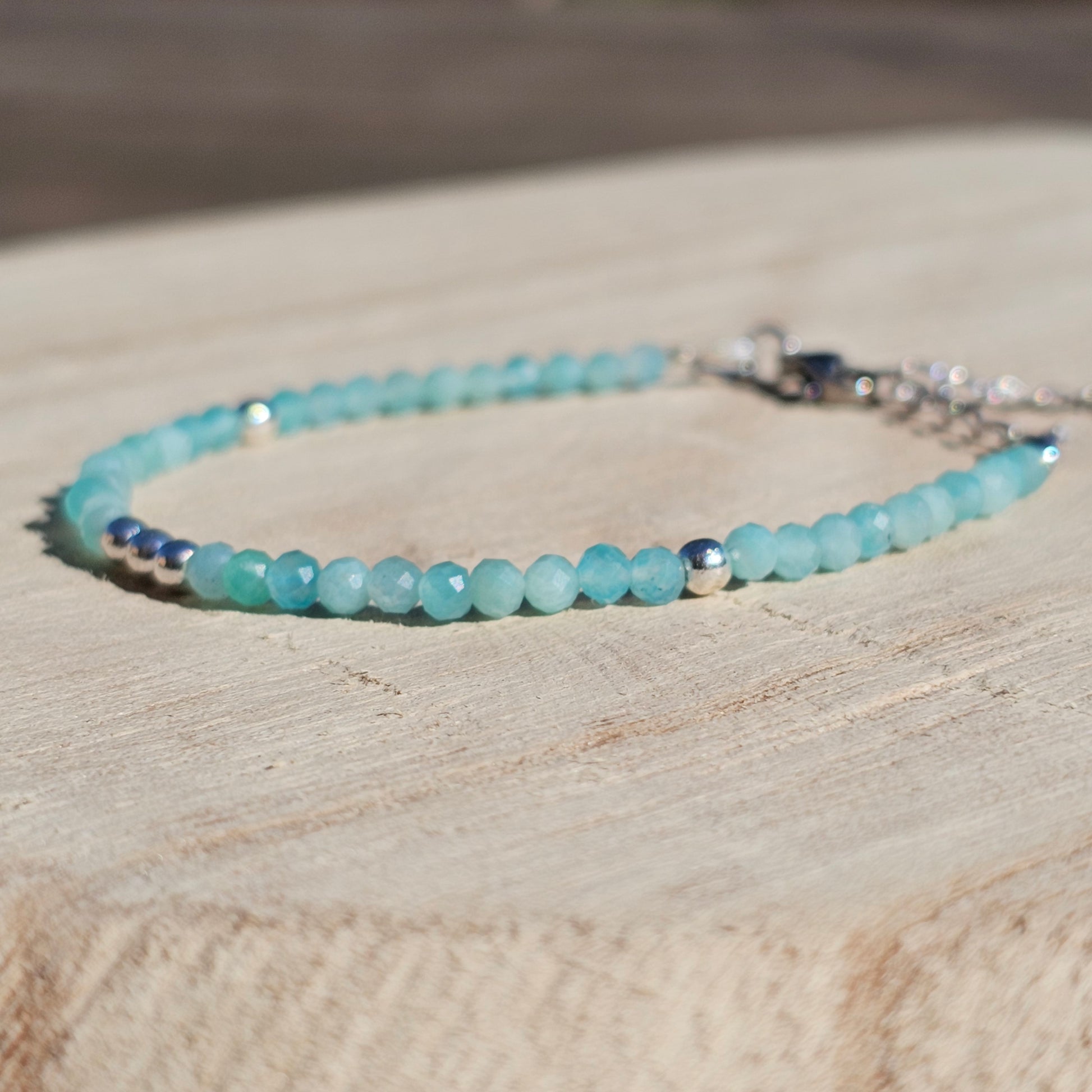 Delicate, faceted dainty A grade Amazonite and AAA grade silver plated Hematite bead bracelet with a silver stainless steel clasp and extender chain.