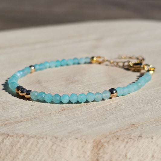 Delicate, faceted dainty A grade Amazonite and AAA grade gold plated Hematite bead bracelet with a gold stainless steel clasp and extender chain.