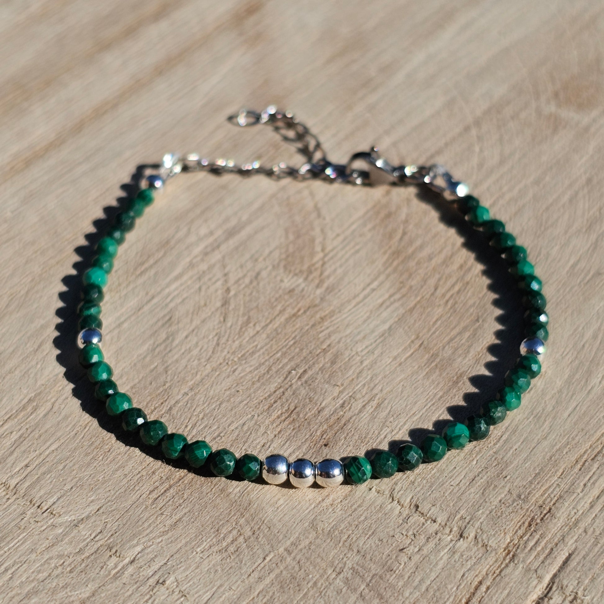 Delicate, faceted dainty Malachite and AAA grade silver plated Hematite bead bracelet with a silver stainless steel clasp and extender chain.