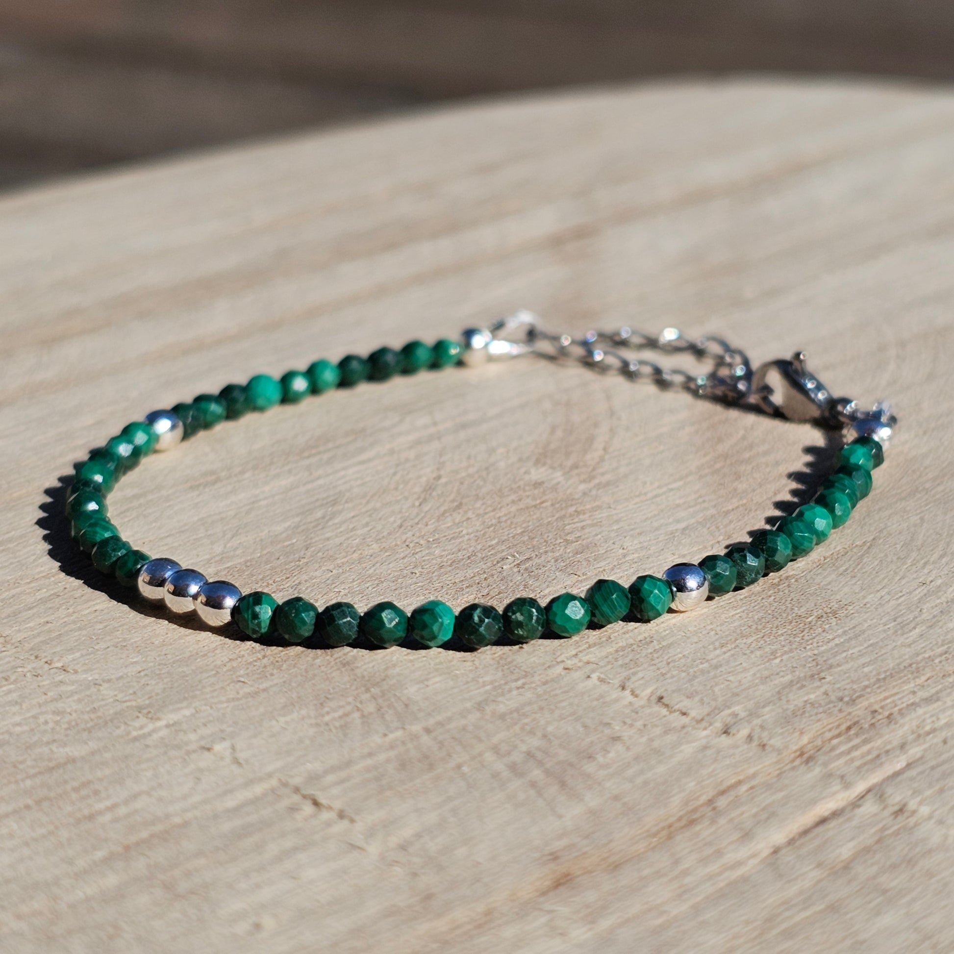 Delicate, faceted dainty Malachite and AAA grade silver plated Hematite bead bracelet with a silver stainless steel clasp and extender chain.