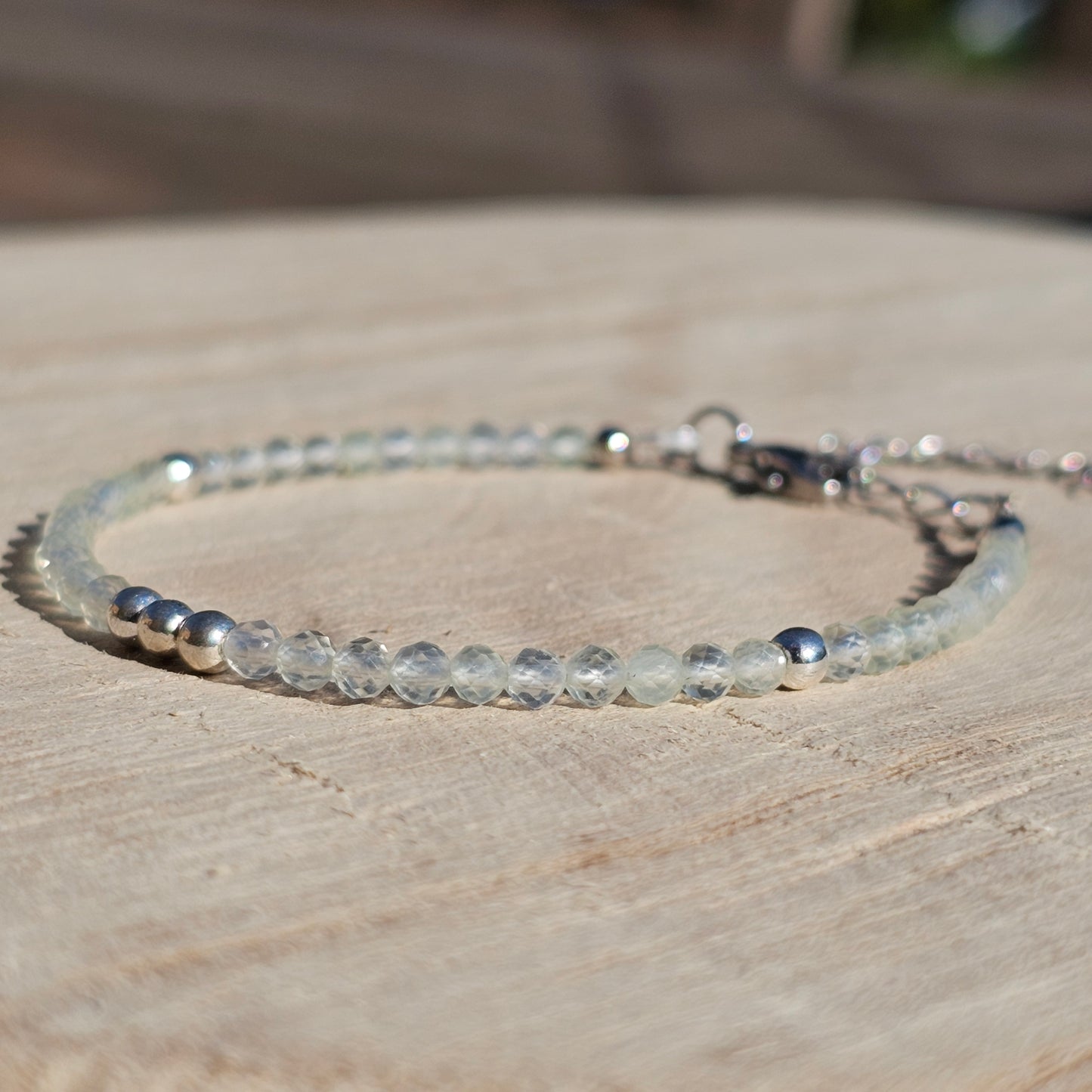 Delicate, faceted dainty Prehnite and AAA grade silver plated Hematite bead bracelet with a silver stainless steel clasp and extender chain.