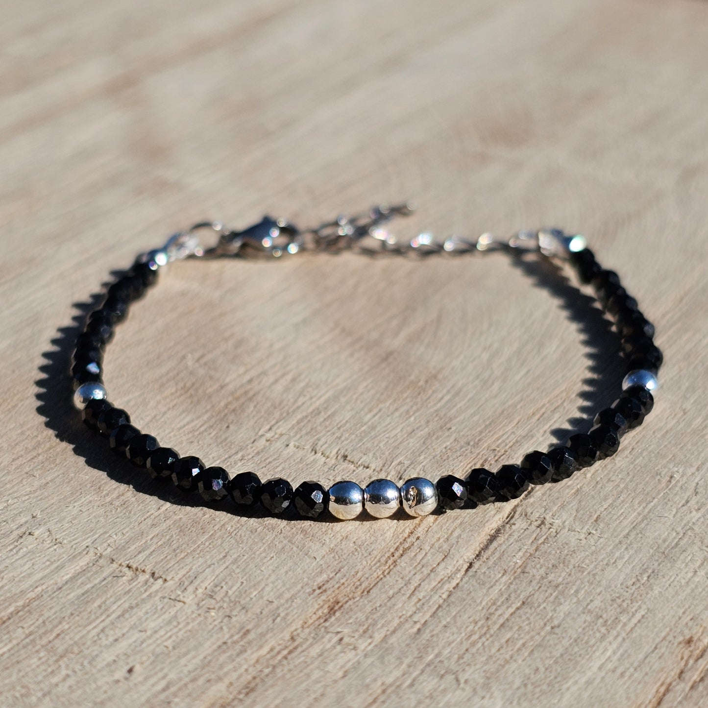 Delicate, faceted dainty Spinel and AAA grade silver plated Hematite bead bracelet with a silver stainless steel clasp and extender chain.