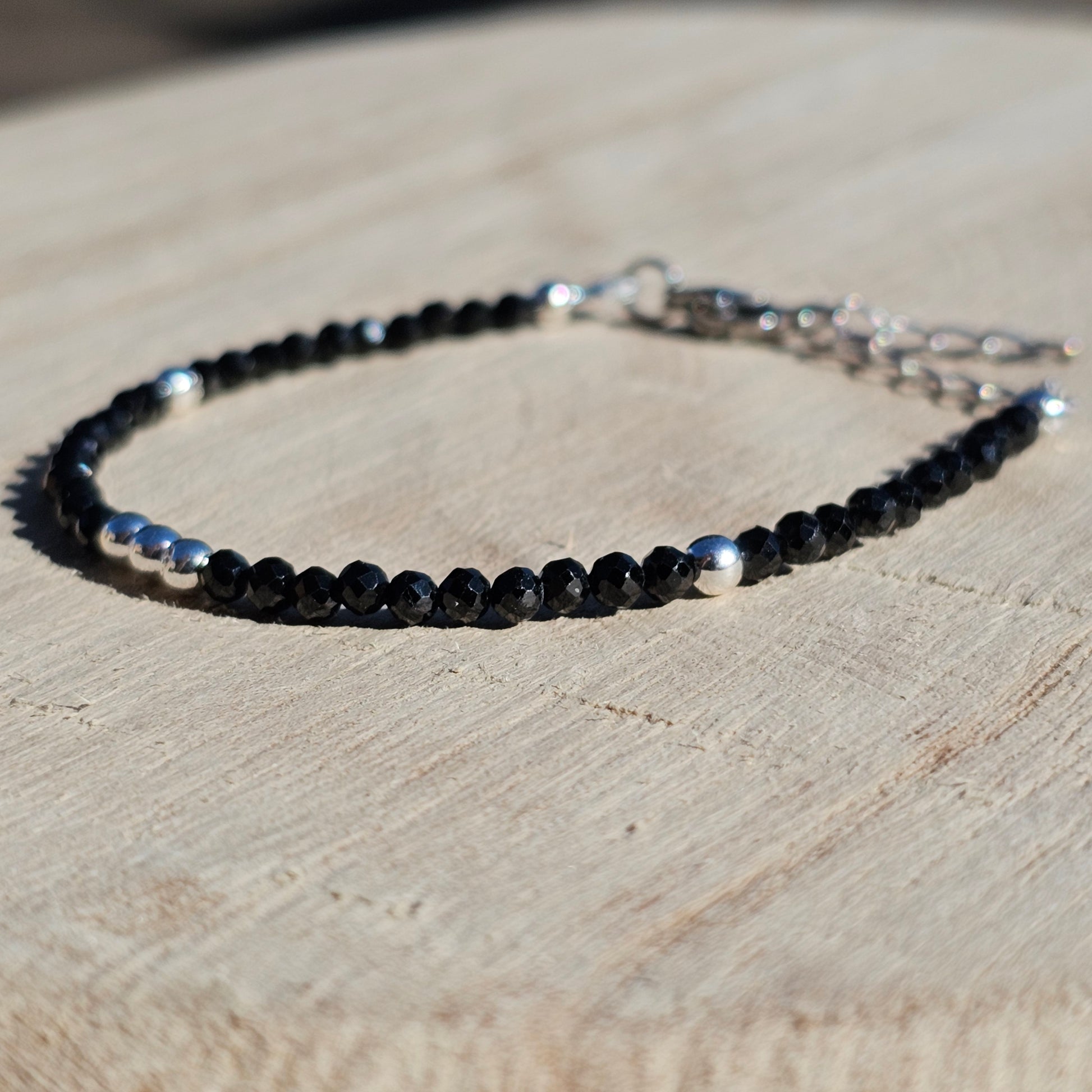 Delicate, faceted dainty Spinel and AAA grade silver plated Hematite bead bracelet with a silver stainless steel clasp and extender chain.