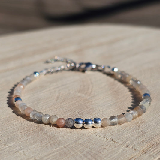 Delicate, faceted dainty Moonstone and AAA grade silver plated Hematite bead bracelet with a silver stainless steel clasp and extender chain.