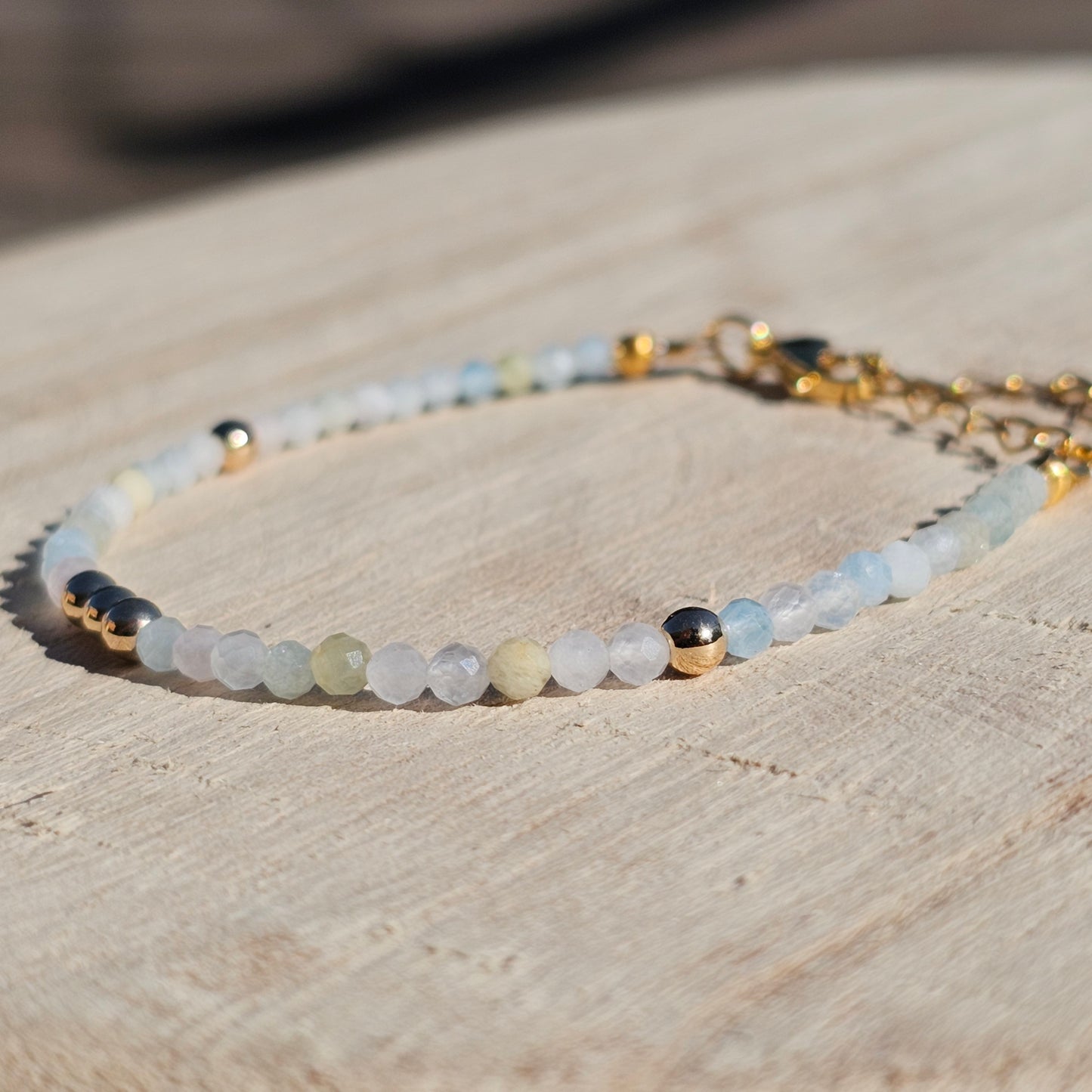 Delicate, faceted dainty Morganite and AAA grade gold plated Hematite bead bracelet with a gold stainless steel clasp and extender chain.