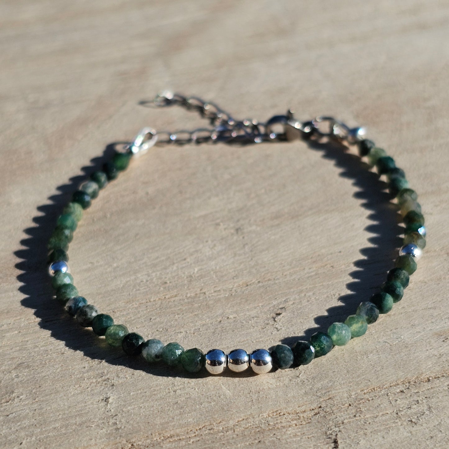 Delicate, faceted dainty Moss Agate and AAA grade silver plated Hematite bead bracelet with a silver stainless steel clasp and extender chain.