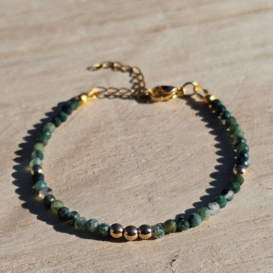 Delicate, faceted dainty Moss Agate and AAA grade gold plated Hematite bead bracelet with a gold stainless steel clasp and extender chain.