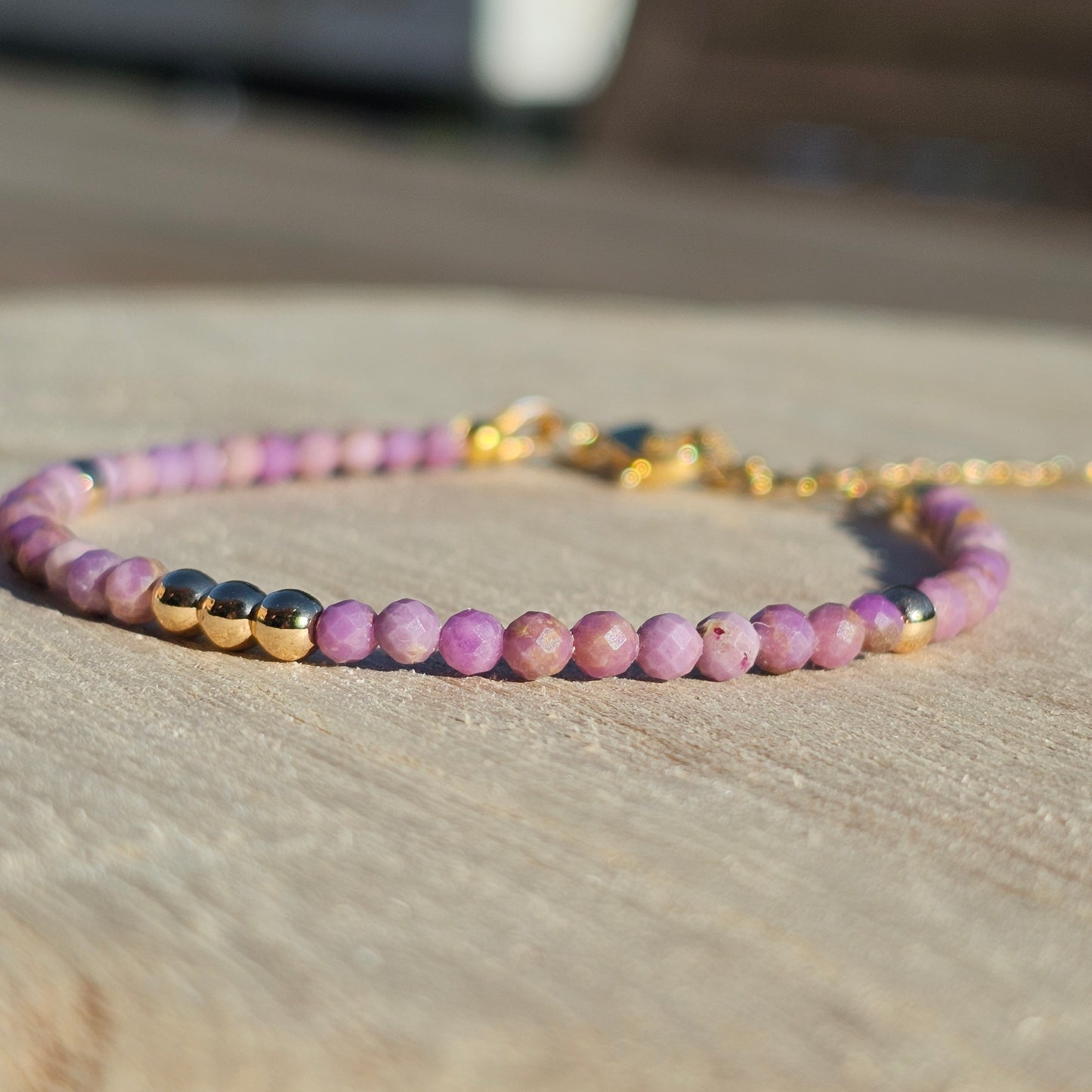 Delicate, faceted dainty Lavender Lepidolite and AAA grade gold plated Hematite bead bracelet with a gold stainless steel clasp and extender chain.