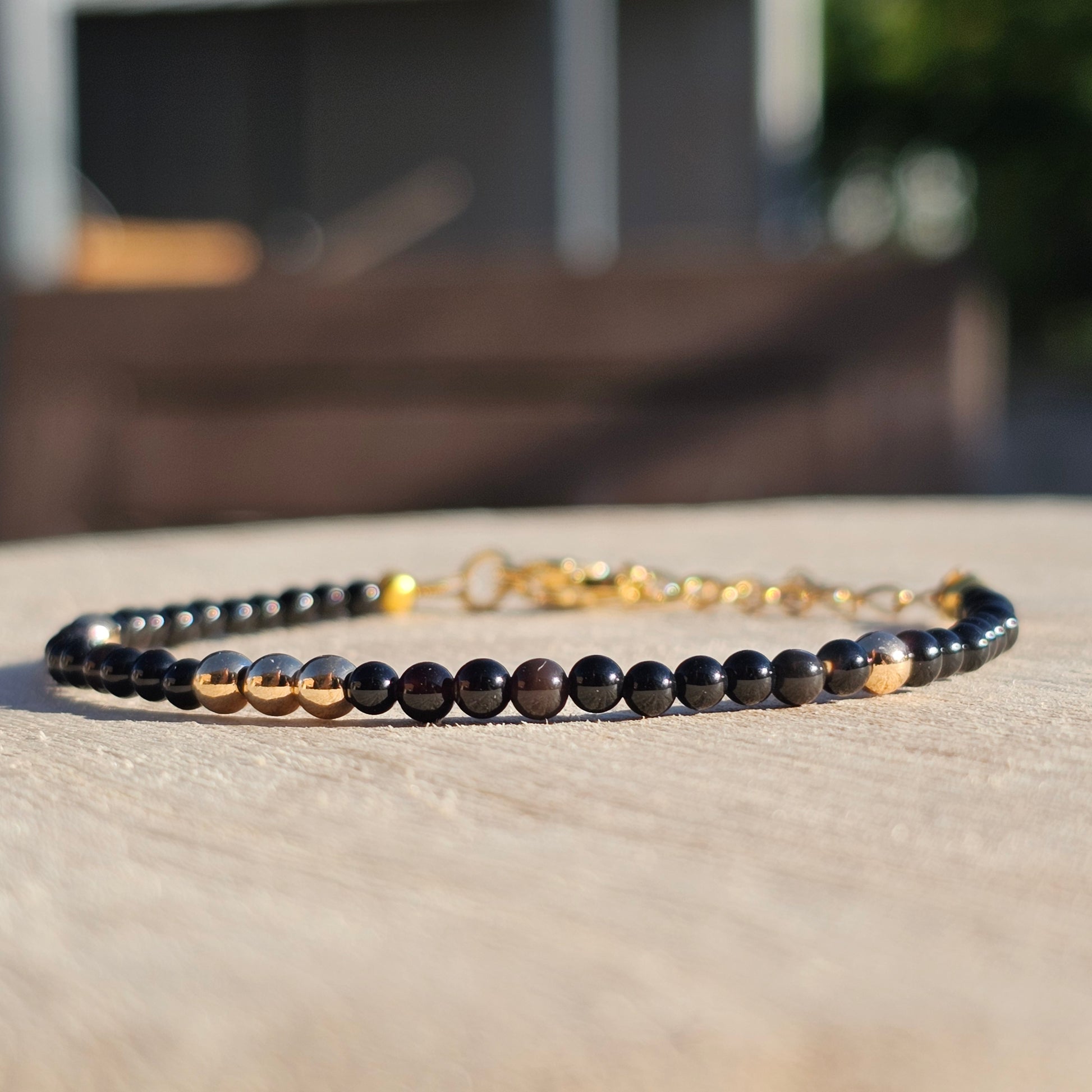 Delicate, round dainty Agate and AAA grade gold plated Hematite bead bracelet with a gold stainless steel clasp and extender chain.