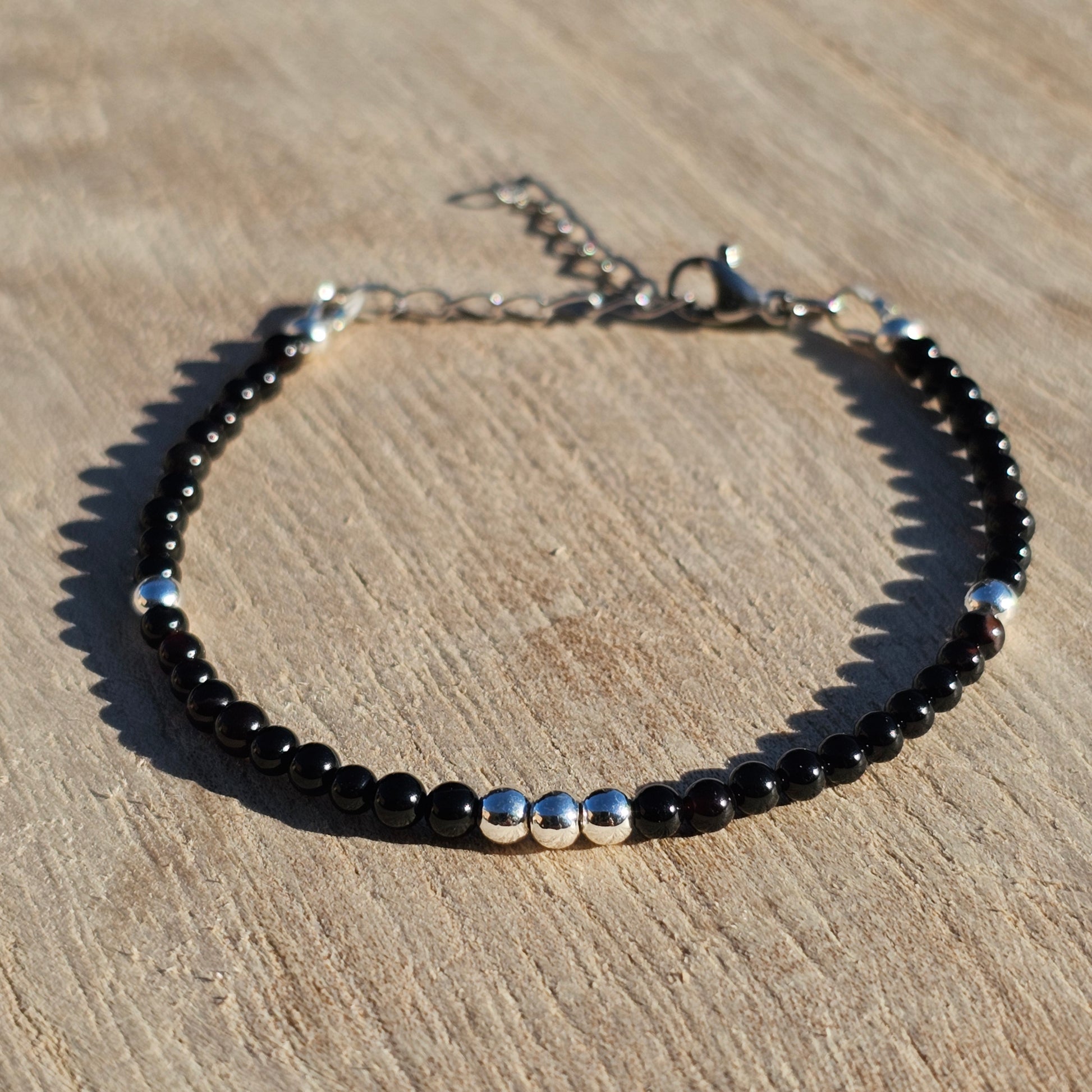 Delicate, round dainty Agate and AAA grade silver plated Hematite bead bracelet with a silver stainless steel clasp and extender chain.