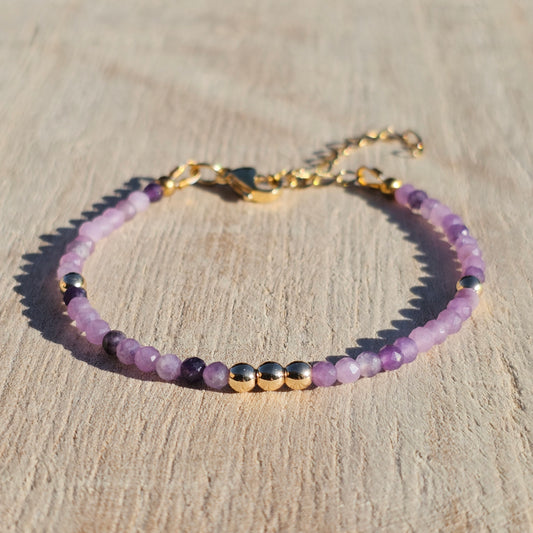 Delicate, faceted dainty Lepidolite and AAA grade gold plated Hematite bead bracelet with a gold stainless steel clasp and extender chain.