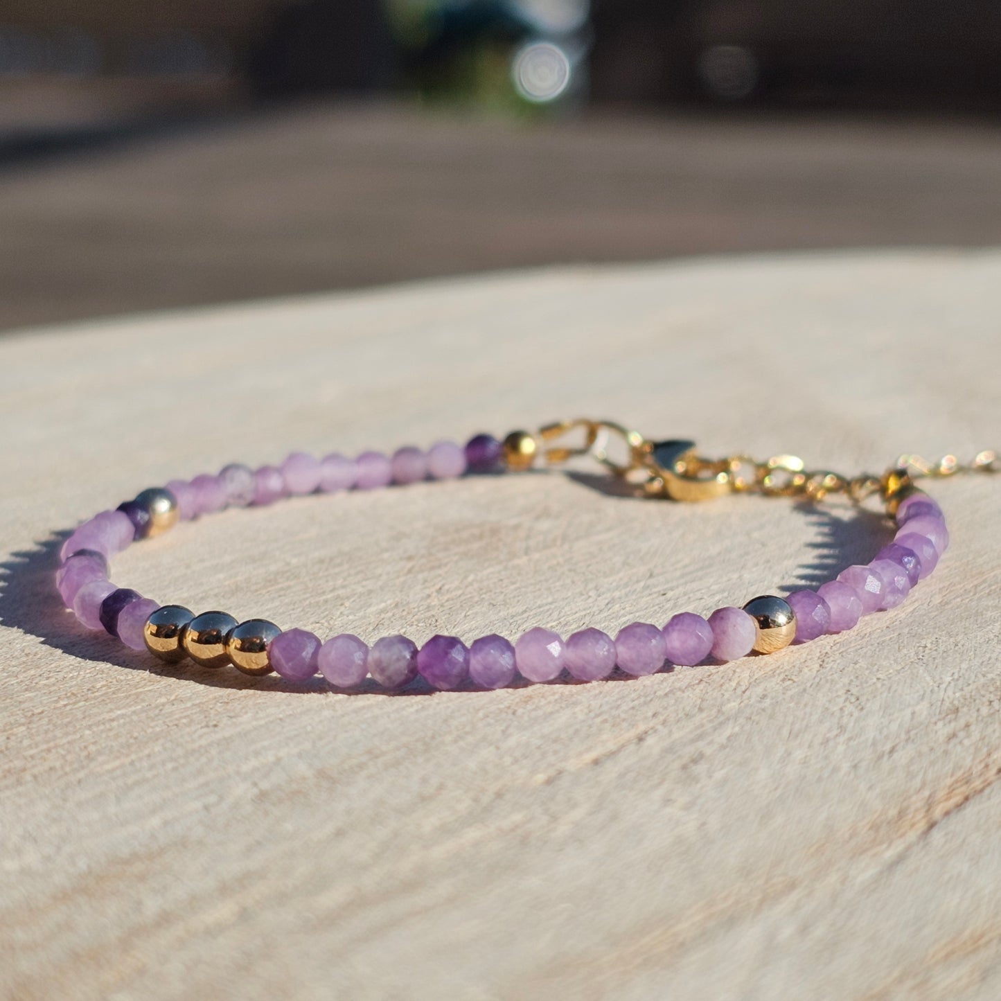 Delicate, faceted dainty Lepidolite and AAA grade gold plated Hematite bead bracelet with a gold stainless steel clasp and extender chain.