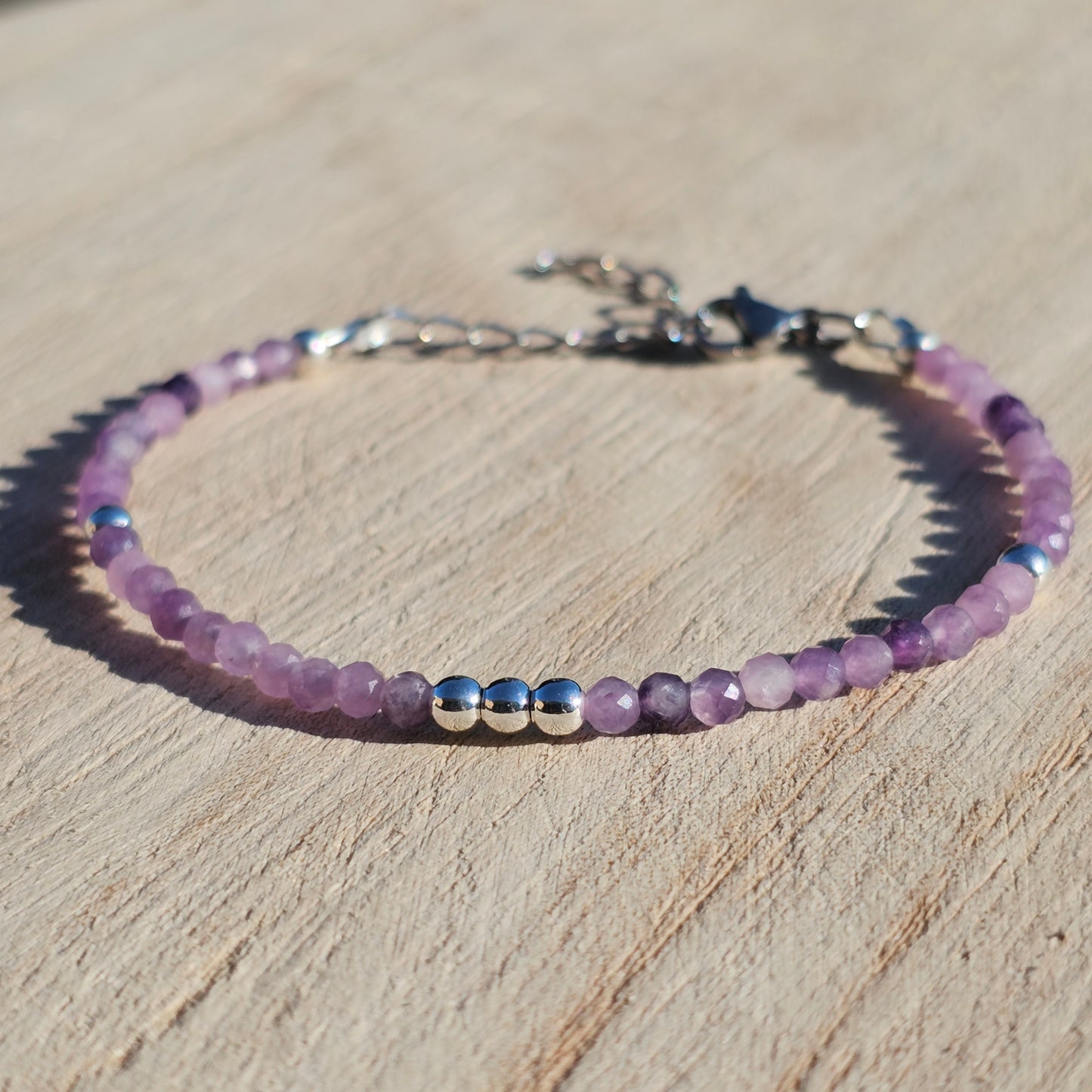 Delicate, faceted dainty Lepidolite and AAA grade silver plated Hematite bead bracelet with a silver stainless steel clasp and extender chain.