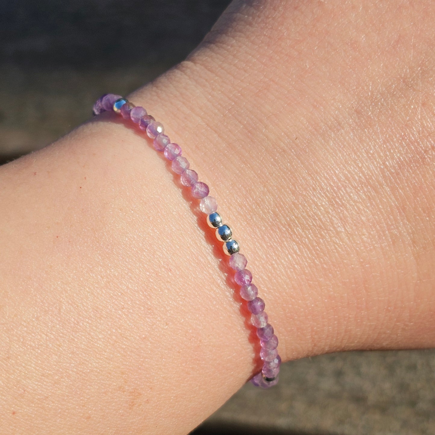 Delicate, faceted dainty AA grade Amethyst and AAA grade silver plated Hematite bead bracelet with a silver stainless steel clasp and extender chain.