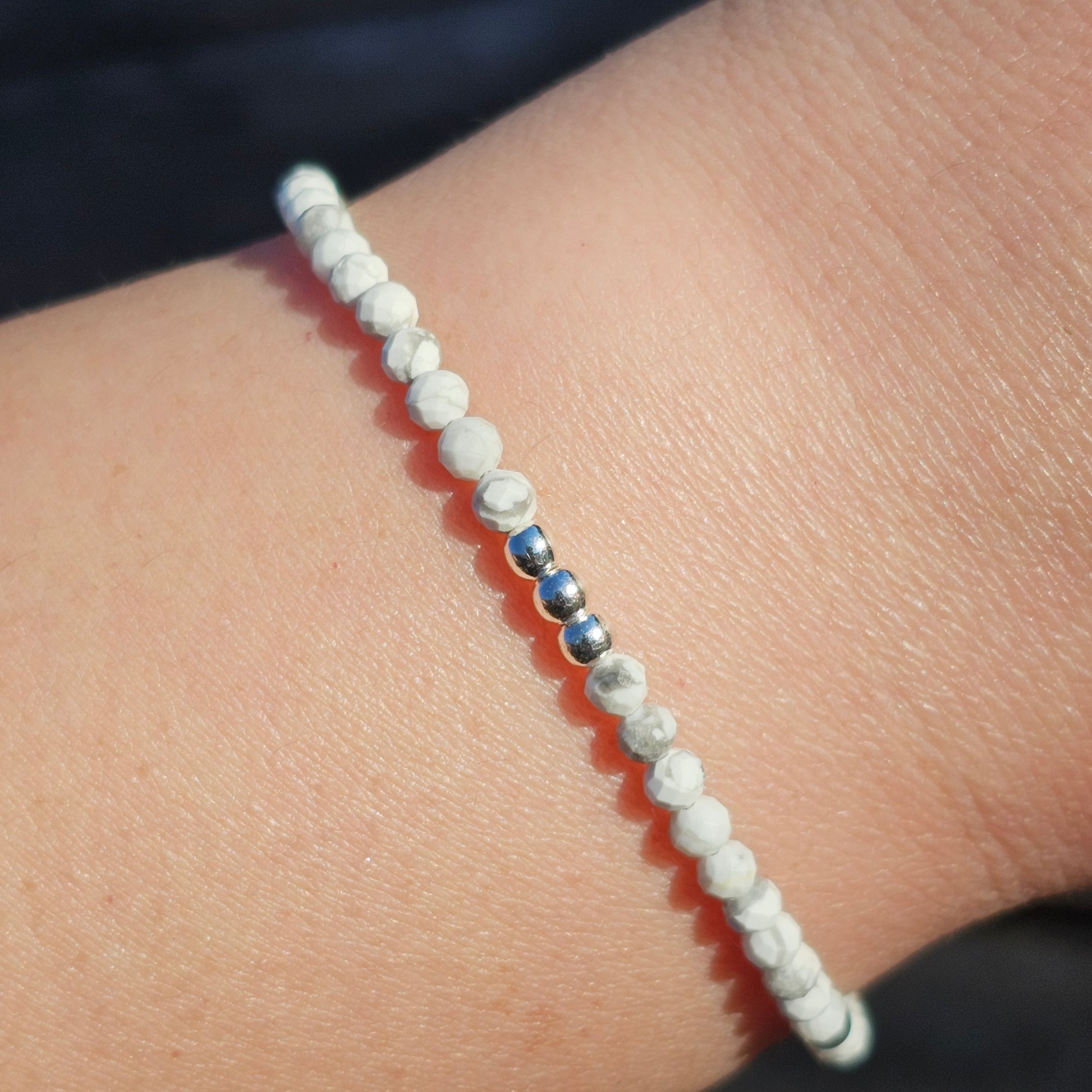 Delicate, faceted dainty AA grade Howlite and AAA grade silver plated Hematite bead bracelet with a silver stainless steel clasp and extender chain.