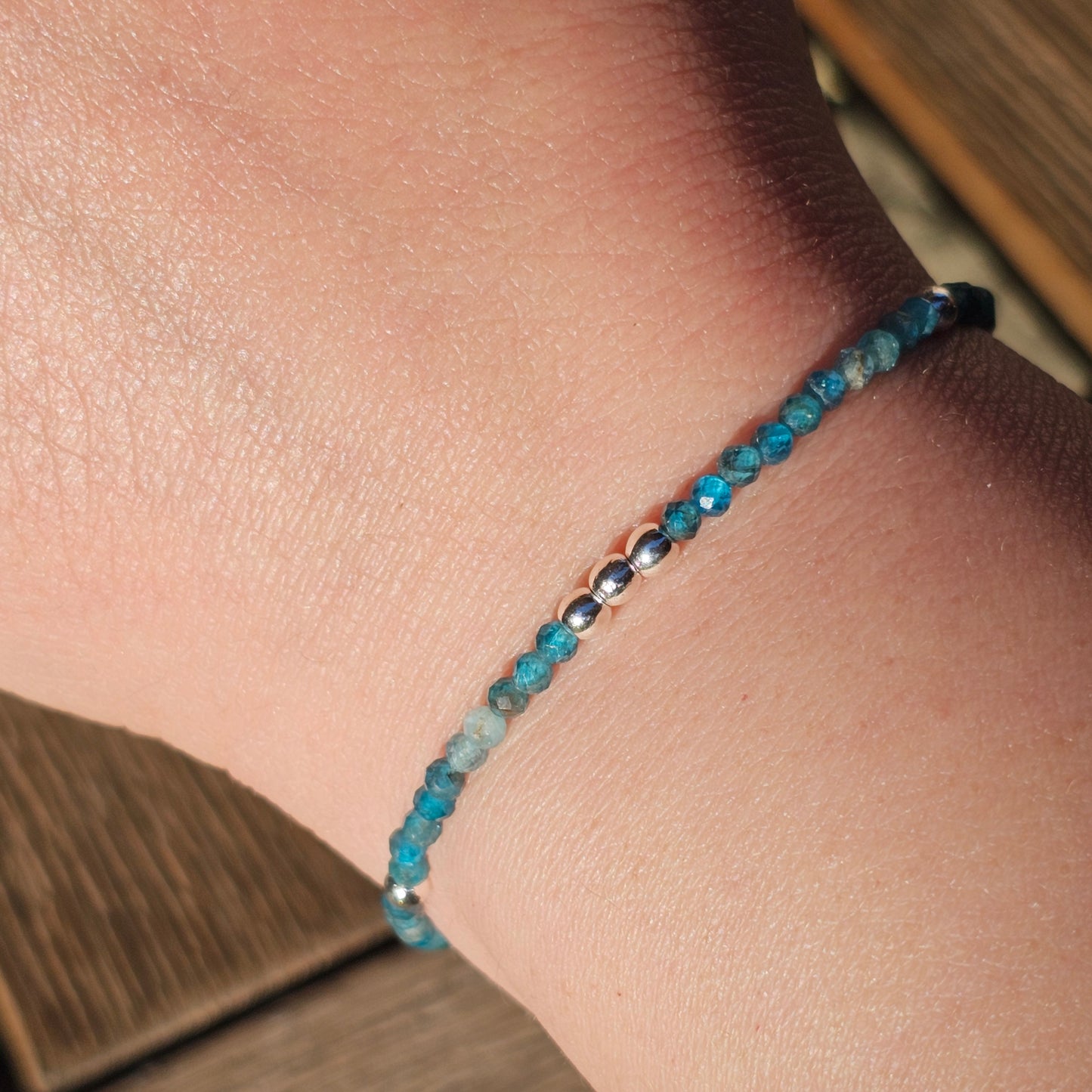 Delicate, faceted dainty AA grade Blue Apatite and AAA grade silver plated Hematite bead bracelet with a silver stainless steel clasp and extender chain.