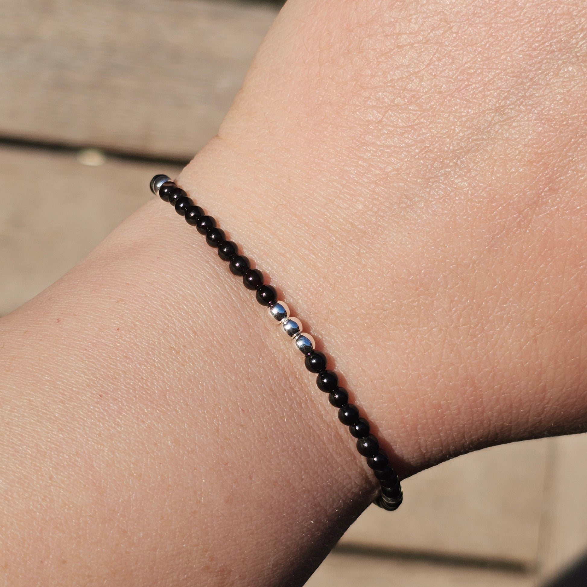 Delicate, round dainty Agate and AAA grade silver plated Hematite bead bracelet with a silver stainless steel clasp and extender chain.