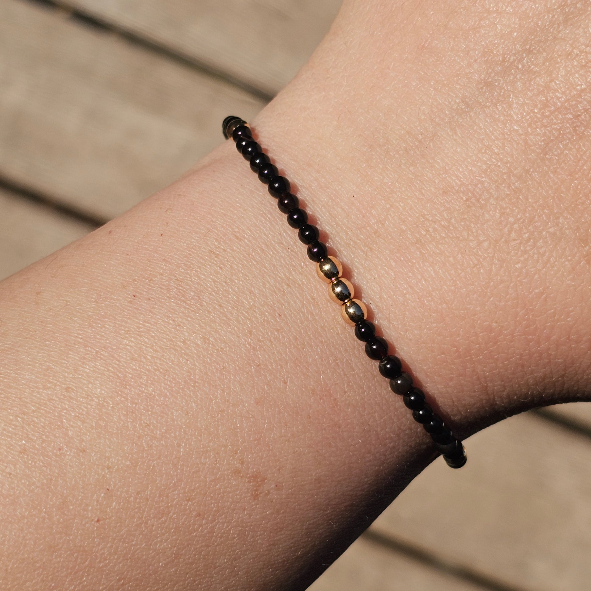 Delicate, round dainty Agate and AAA grade gold plated Hematite bead bracelet with a gold stainless steel clasp and extender chain.