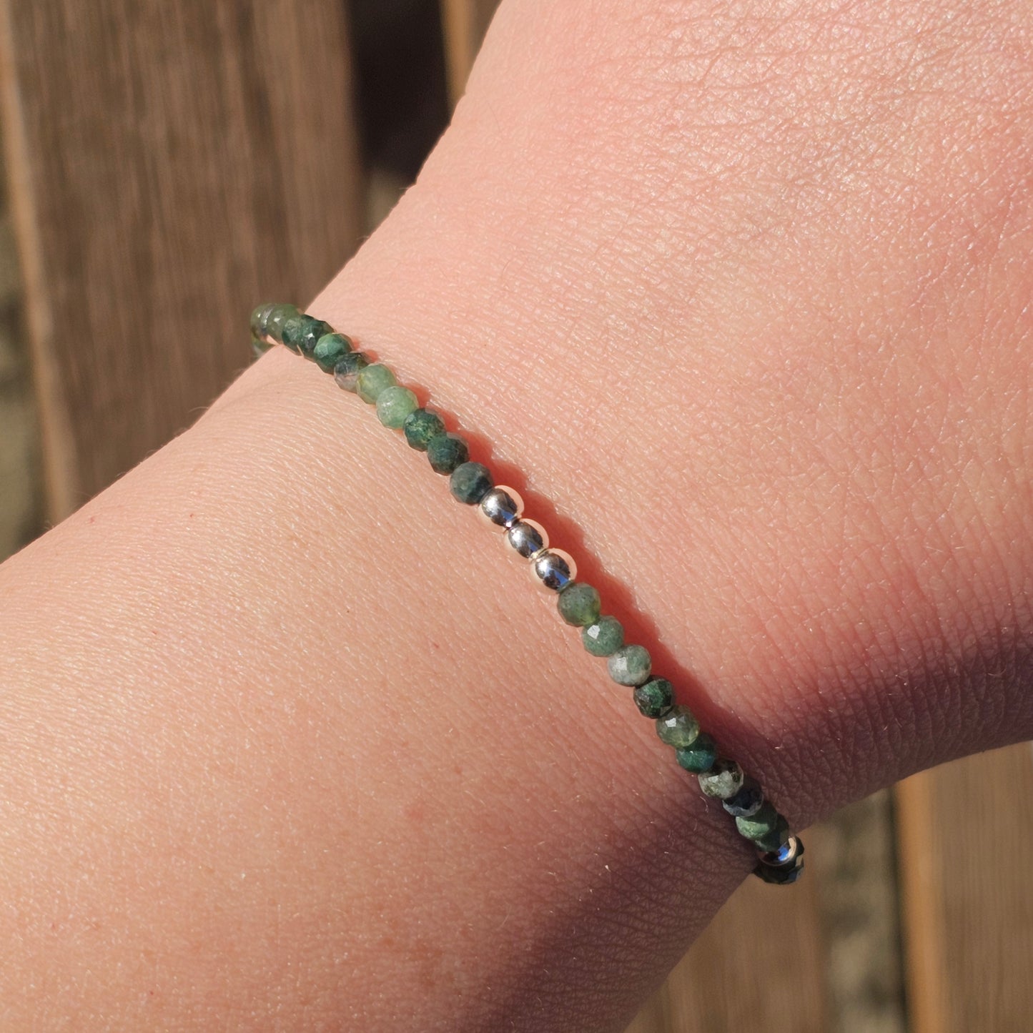 Delicate, faceted dainty Moss Agate and AAA grade silver plated Hematite bead bracelet with a silver stainless steel clasp and extender chain.