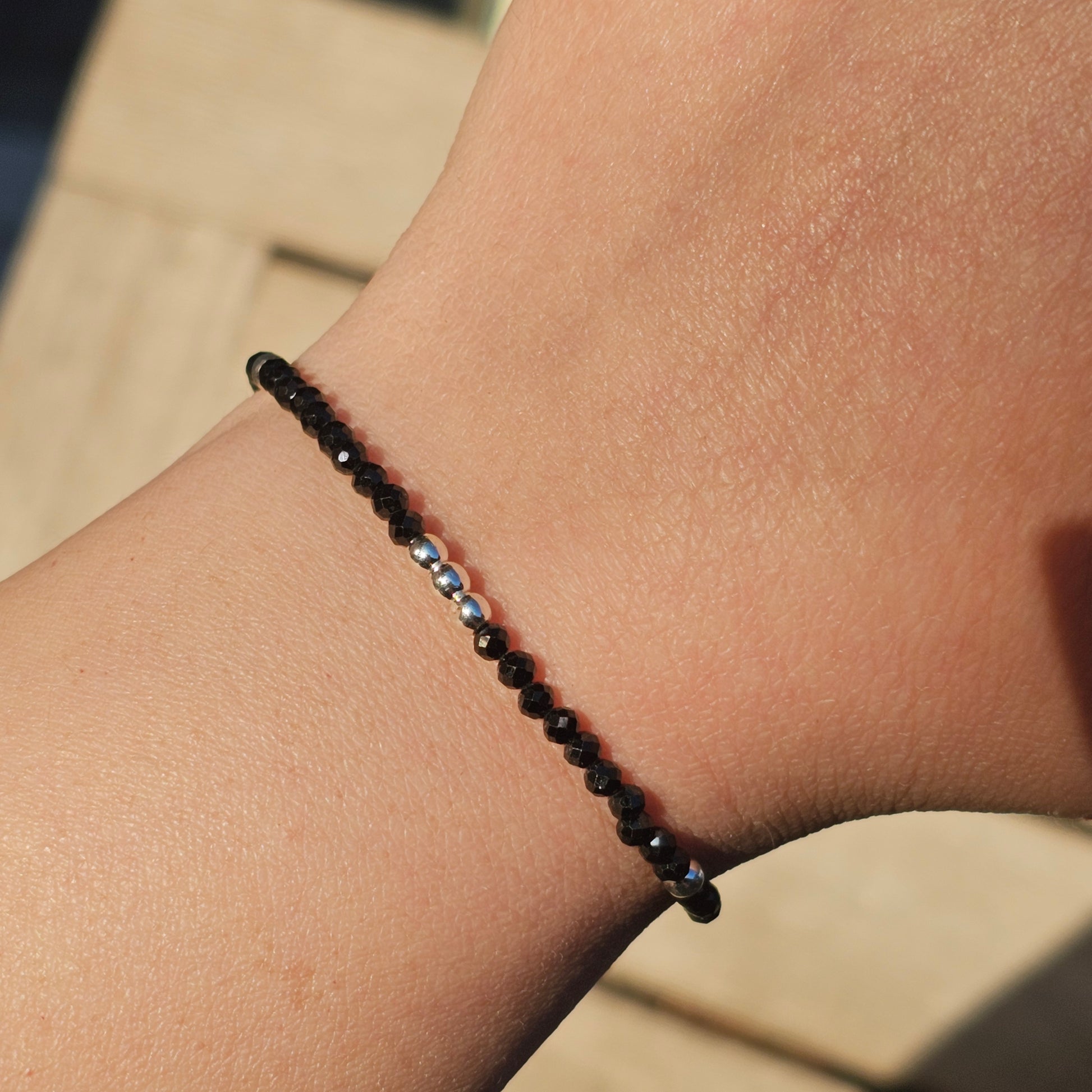 Delicate, faceted dainty Spinel and AAA grade silver plated Hematite bead bracelet with a silver stainless steel clasp and extender chain.