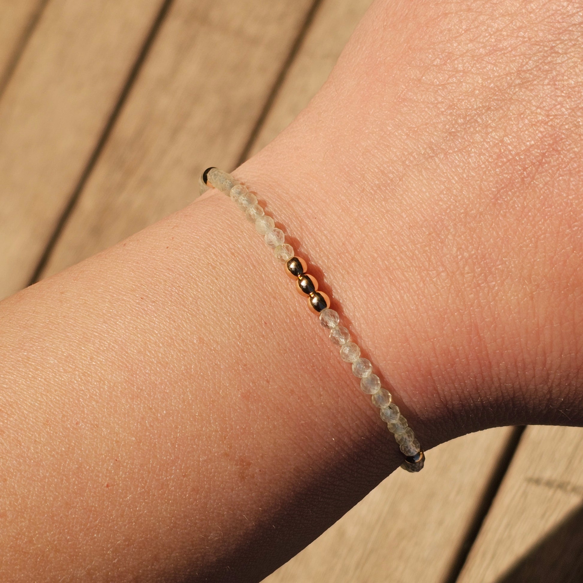 Delicate, faceted dainty Prehnite and AAA grade gold plated Hematite bead bracelet with a gold stainless steel clasp and extender chain.