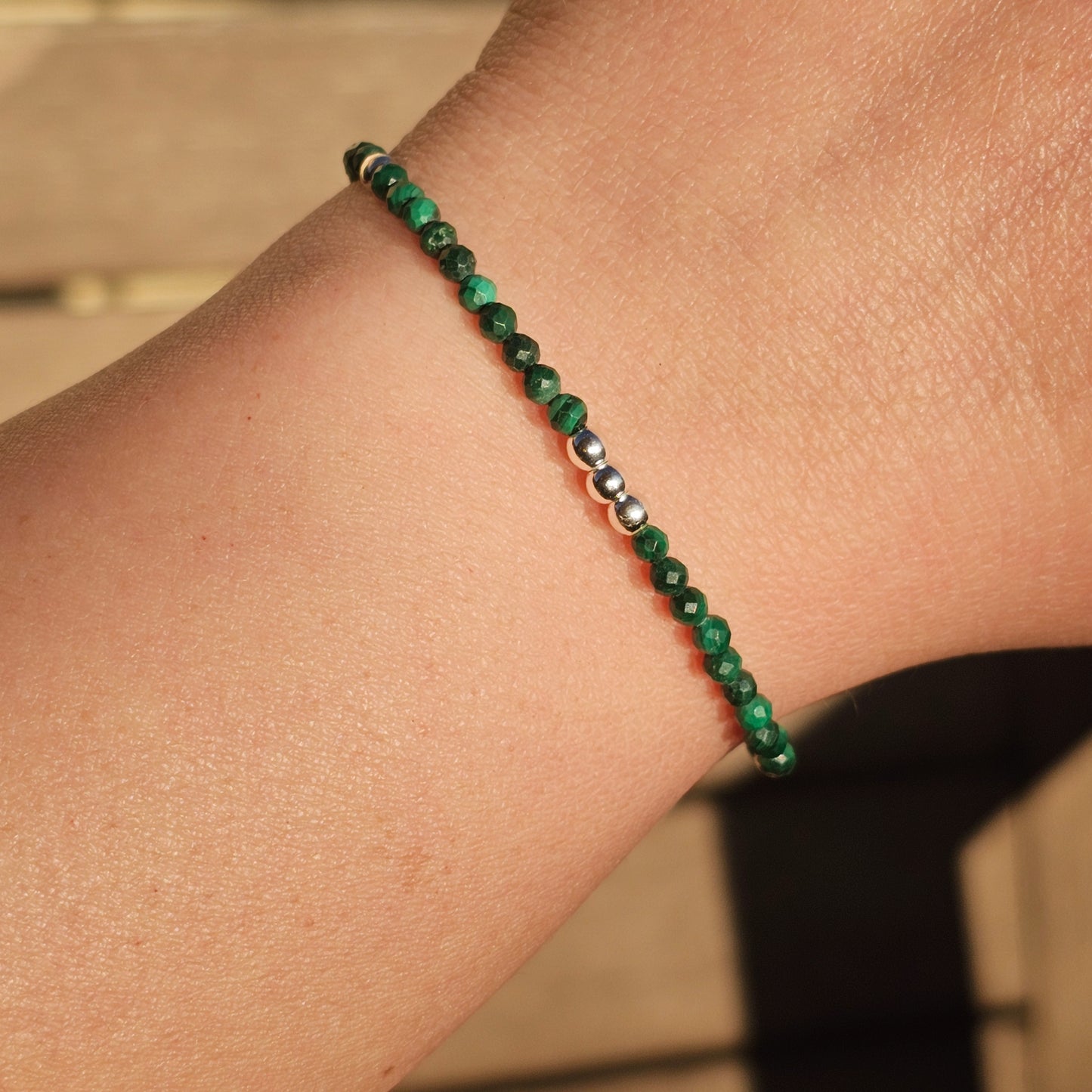 Delicate, faceted dainty Malachite and AAA grade silver plated Hematite bead bracelet with a silver stainless steel clasp and extender chain.