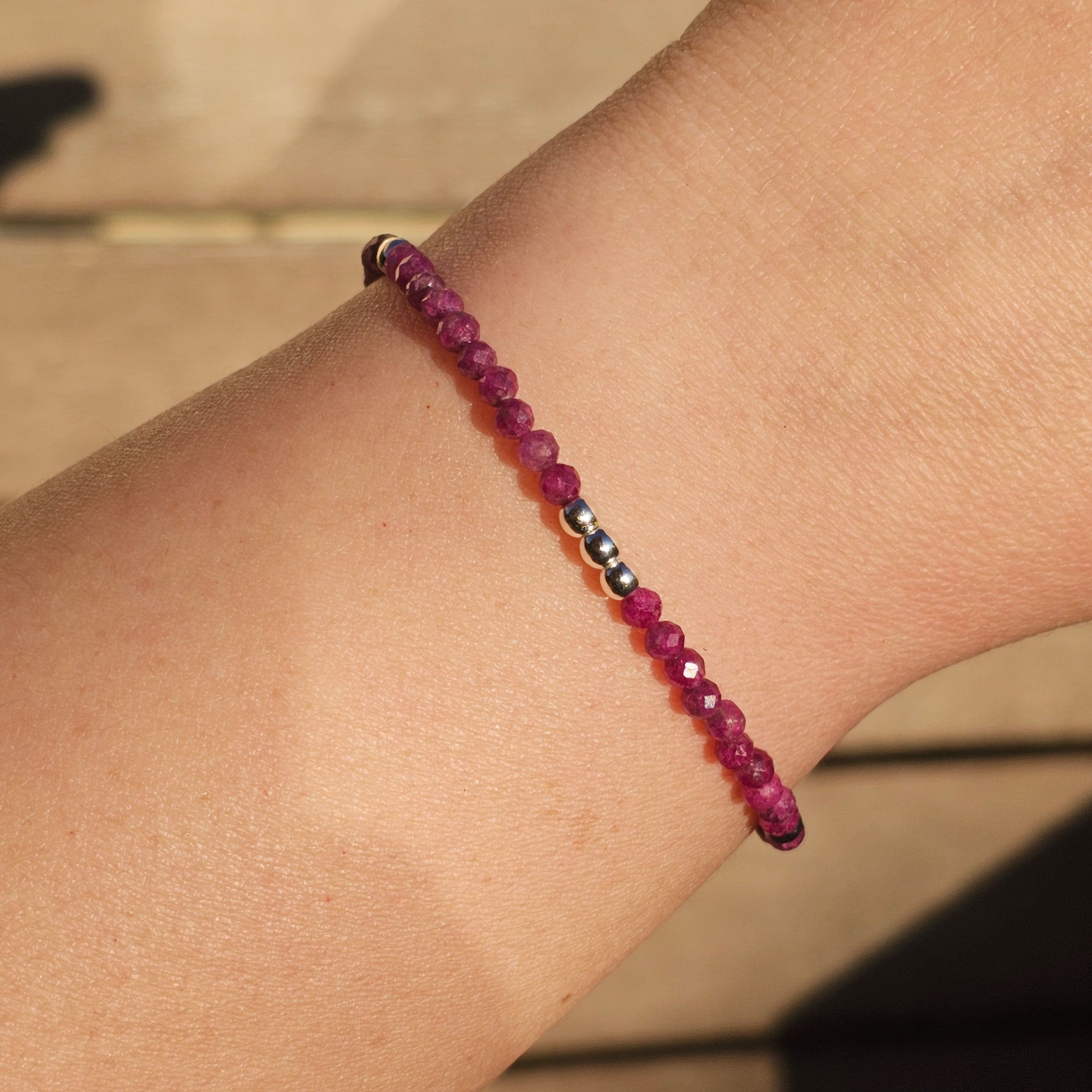 Delicate, faceted dainty Ruby and AAA grade silver plated Hematite bead bracelet with a silver stainless steel clasp and extender chain.