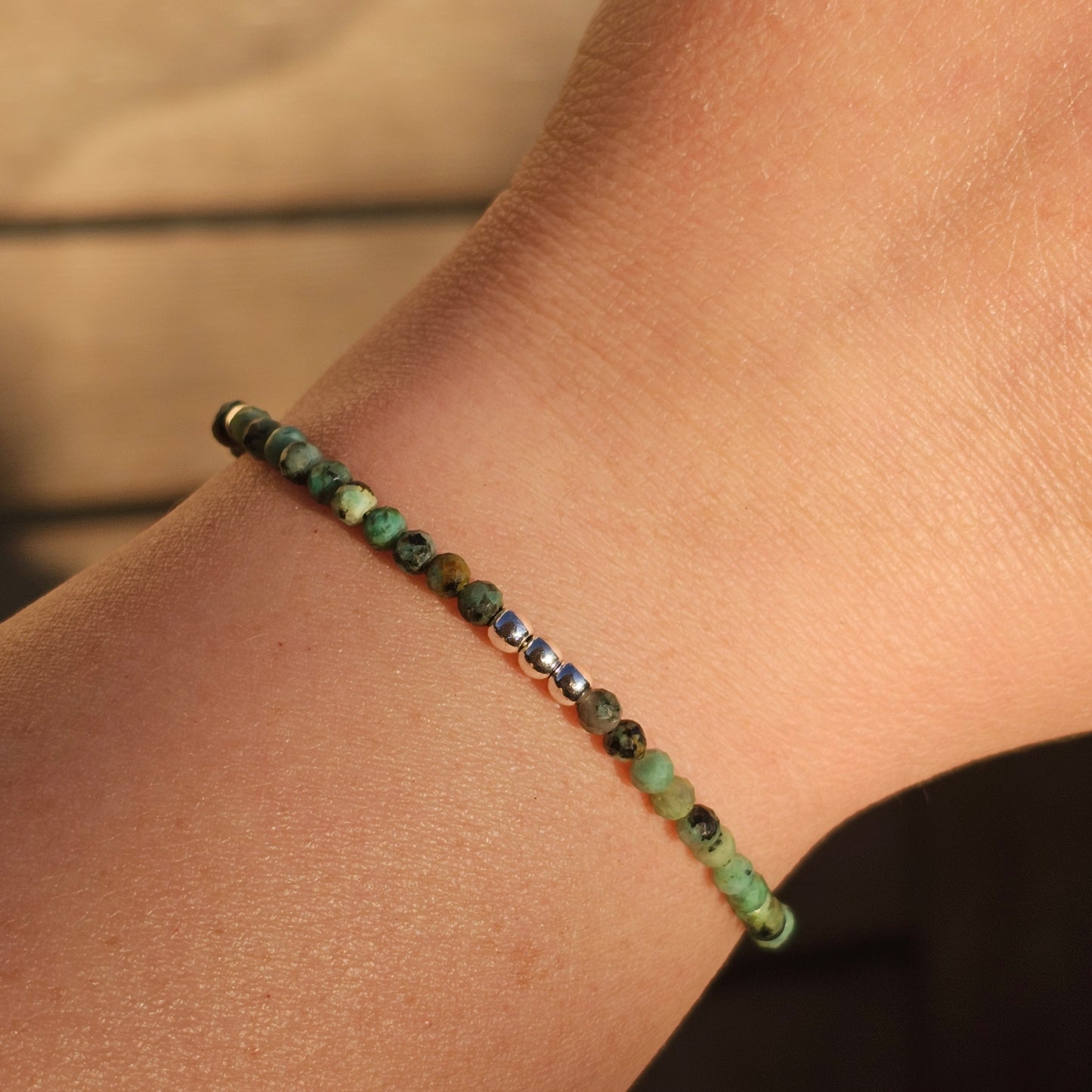 Delicate, faceted dainty African Turquoise and AAA grade silver plated Hematite bead bracelet with a silver stainless steel clasp and extender chain.