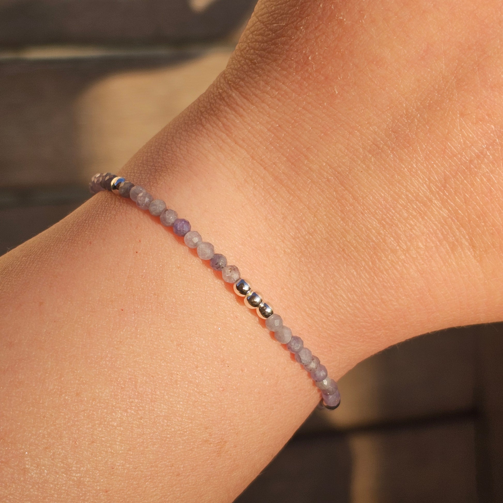 Delicate, faceted dainty Tanzanite and AAA grade silver plated Hematite bead bracelet with a silver stainless steel clasp and extender chain.