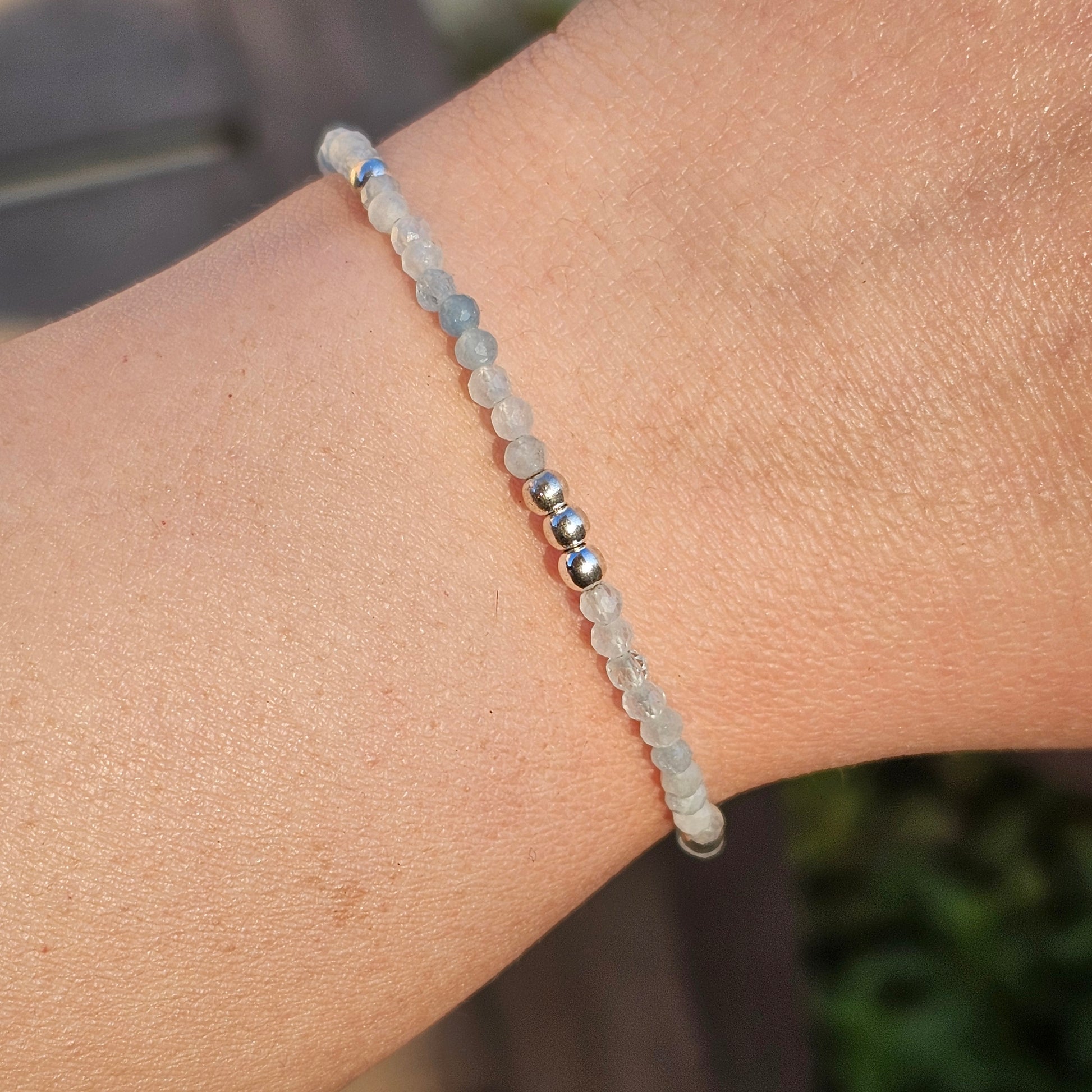 Delicate, faceted dainty Aquamarine and AAA grade silver plated Hematite bead bracelet with a silver stainless steel clasp and extender chain.