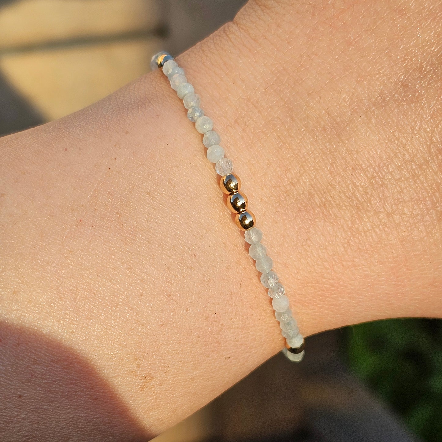 Delicate, faceted dainty Aquamarine and AAA grade gold plated Hematite bead bracelet with a gold stainless steel clasp and extender chain.